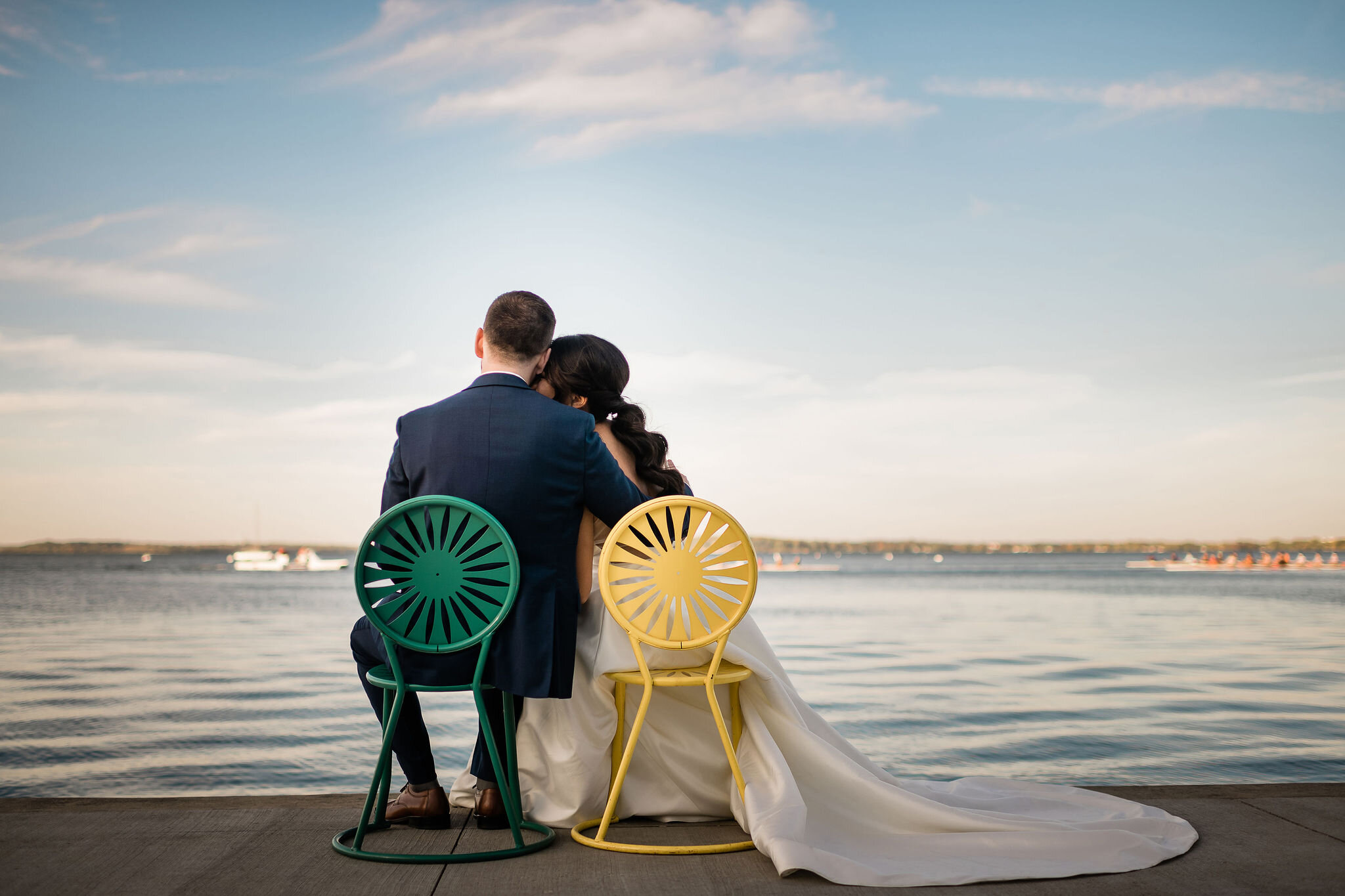 Bride and groom sitting on chairs at Memorial Union Terrace