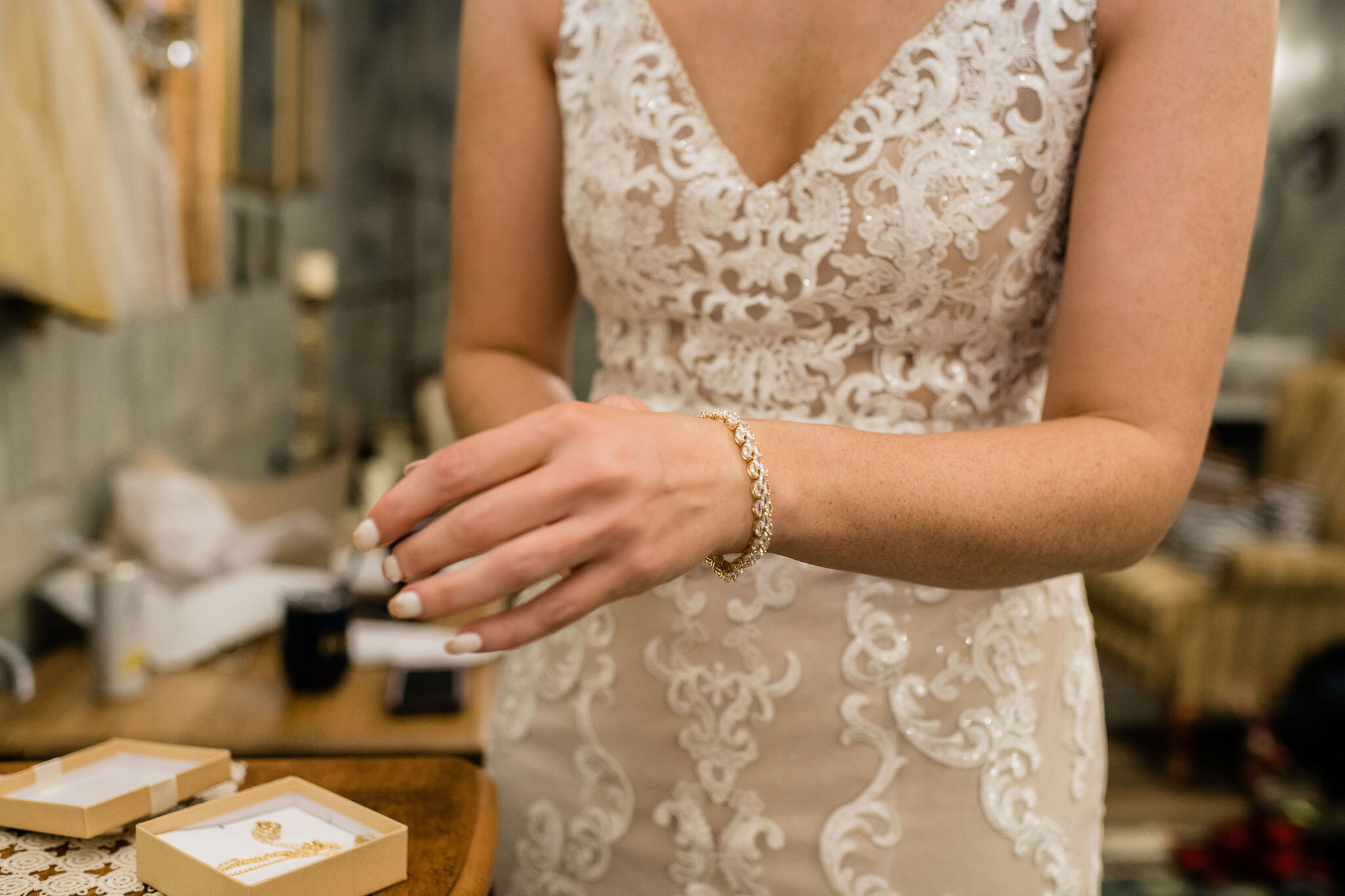 Bride putting on her bracelet