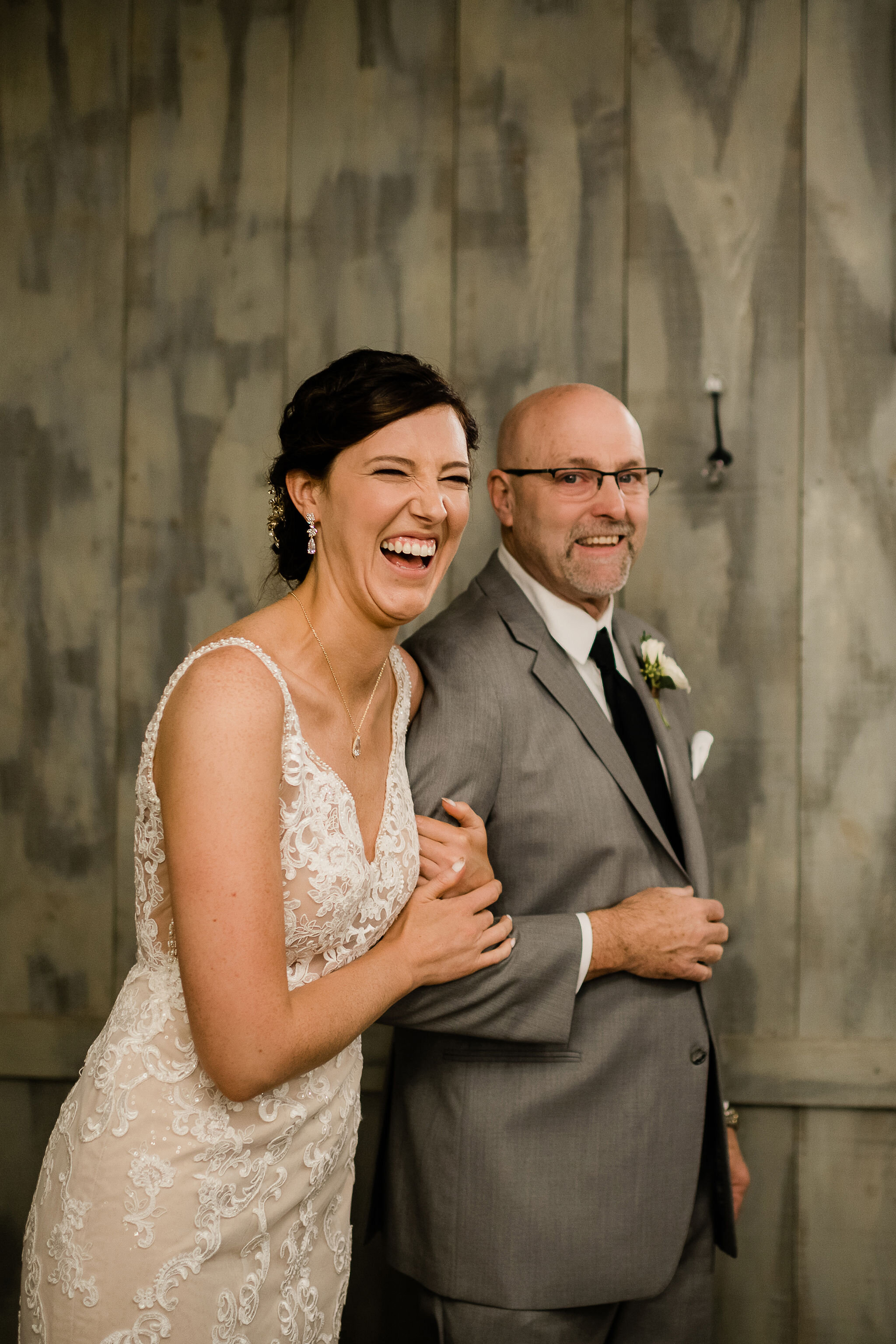 Bride laughing with her dad
