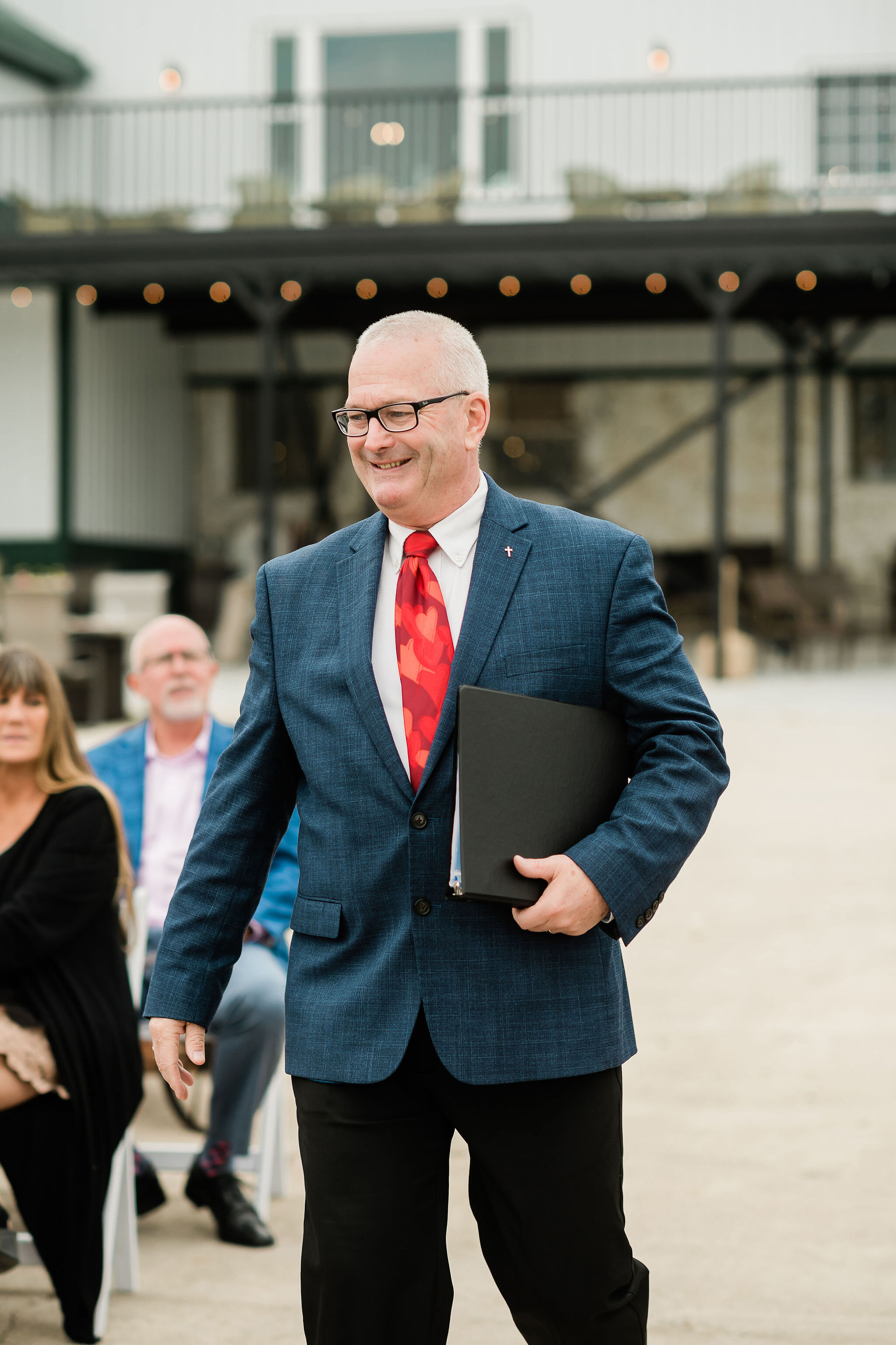 Officiant walking down the aisle