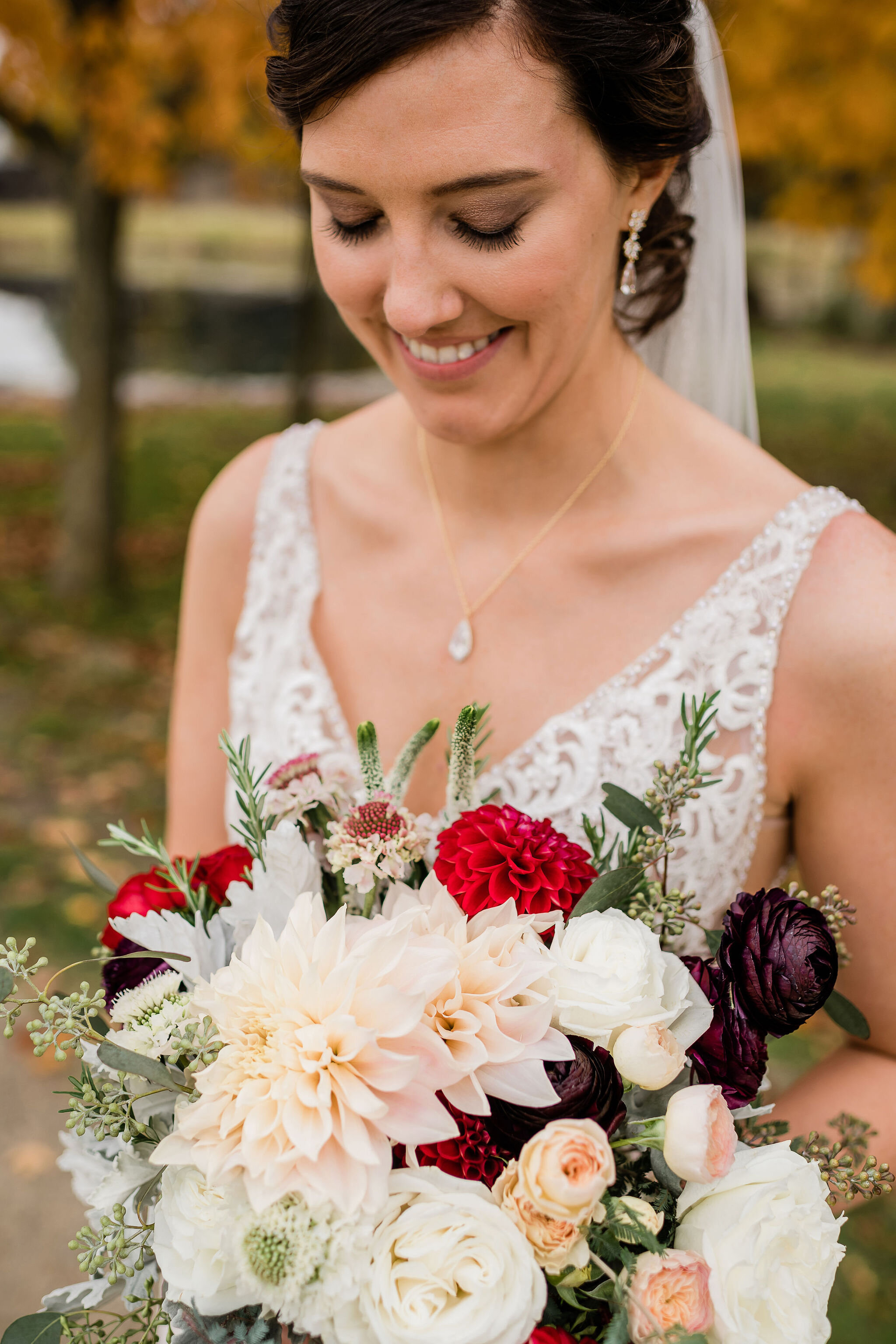 Bride looking down at her bouquet