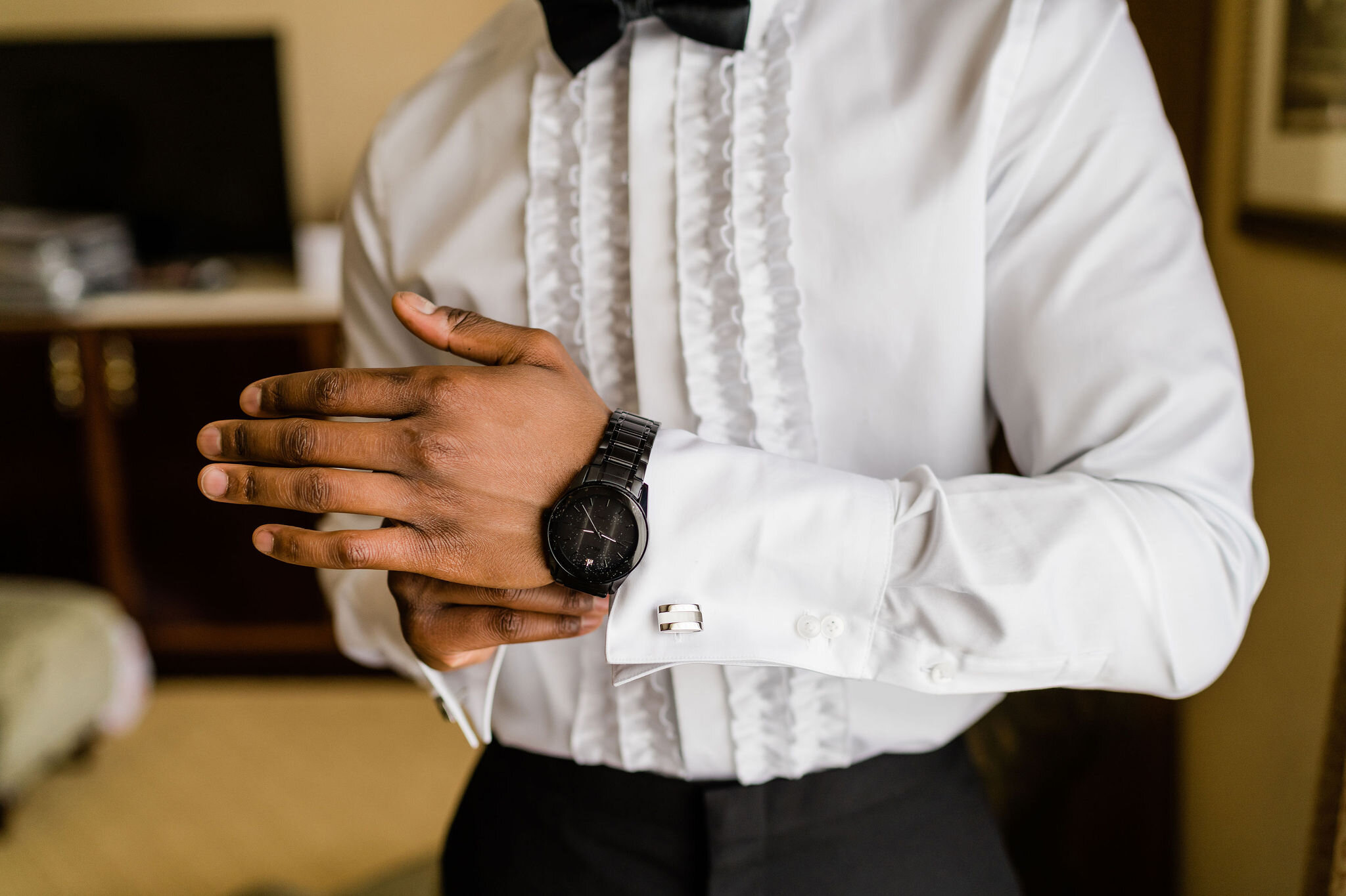 Groom putting his watch on