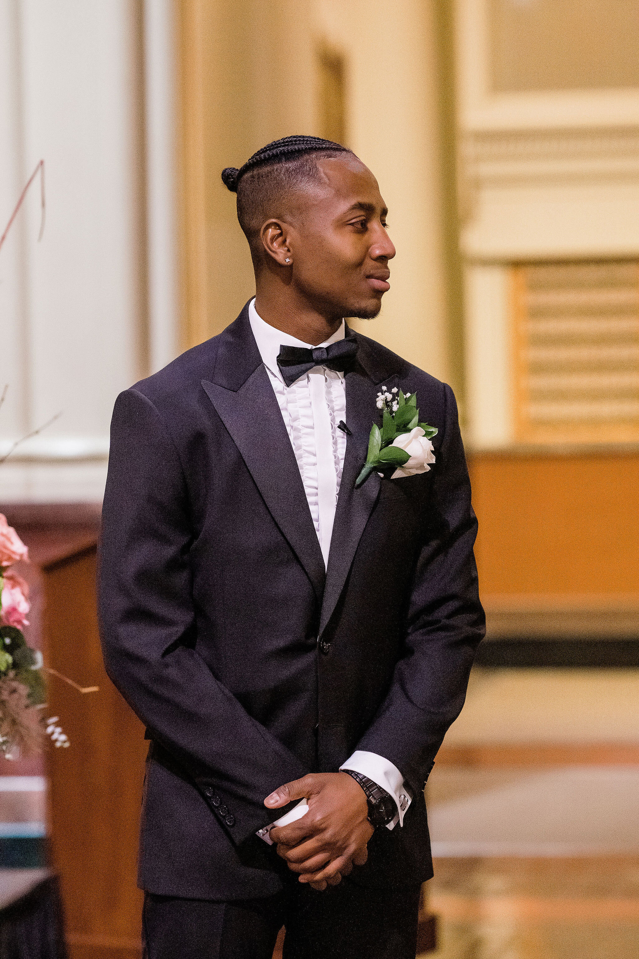 Groom waiting for bride to walk down the aisle