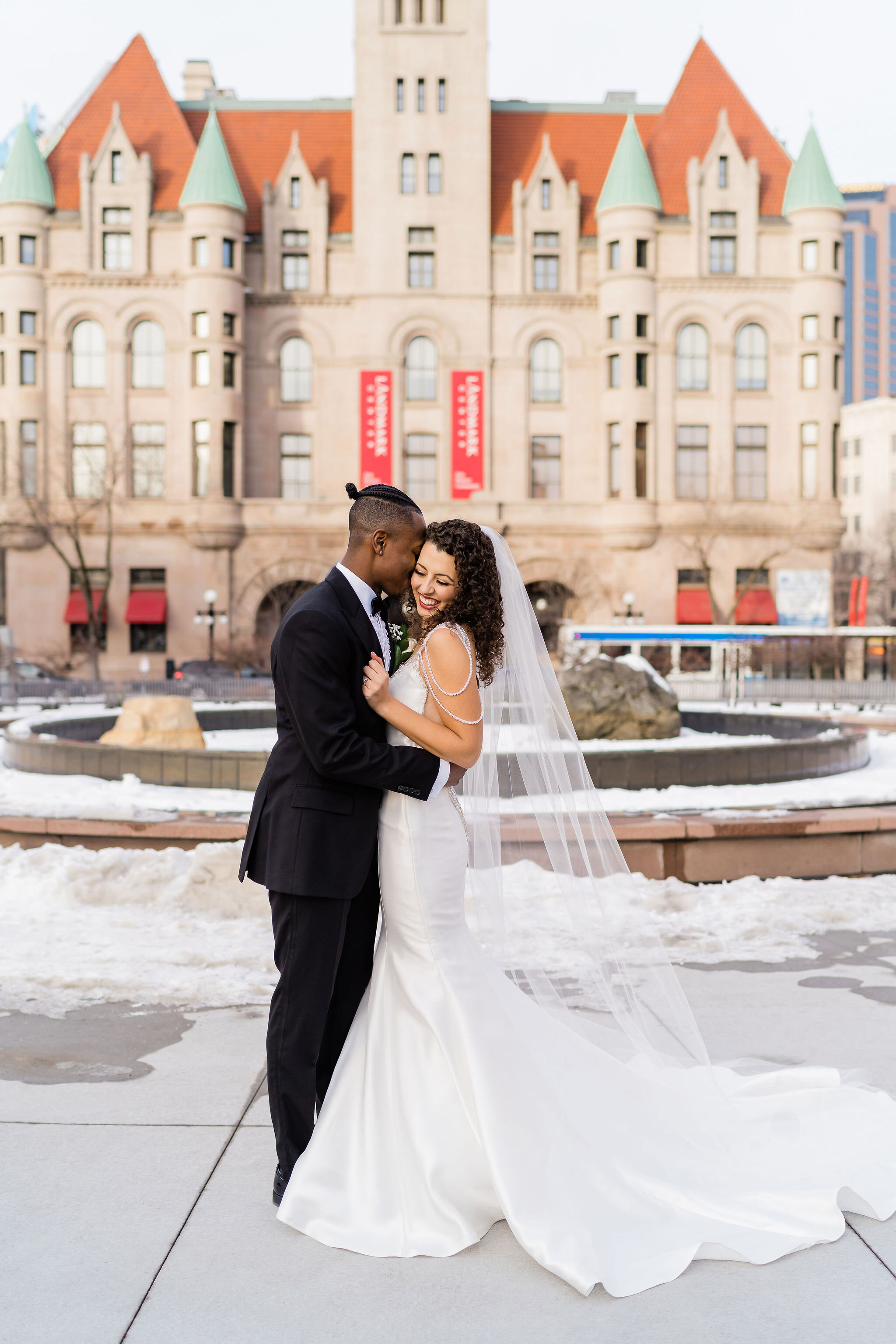Bride and groom in front of Landmark Center in St Paul, MN