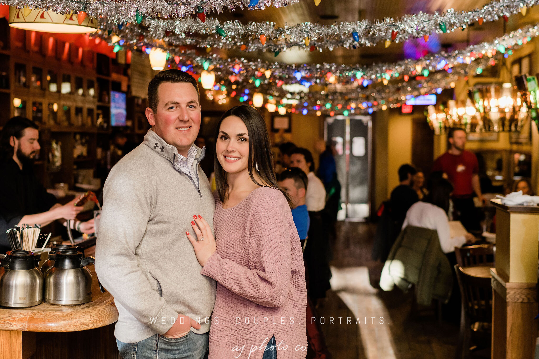 Engaged couple inside The Old Fashioned in Madison, WI