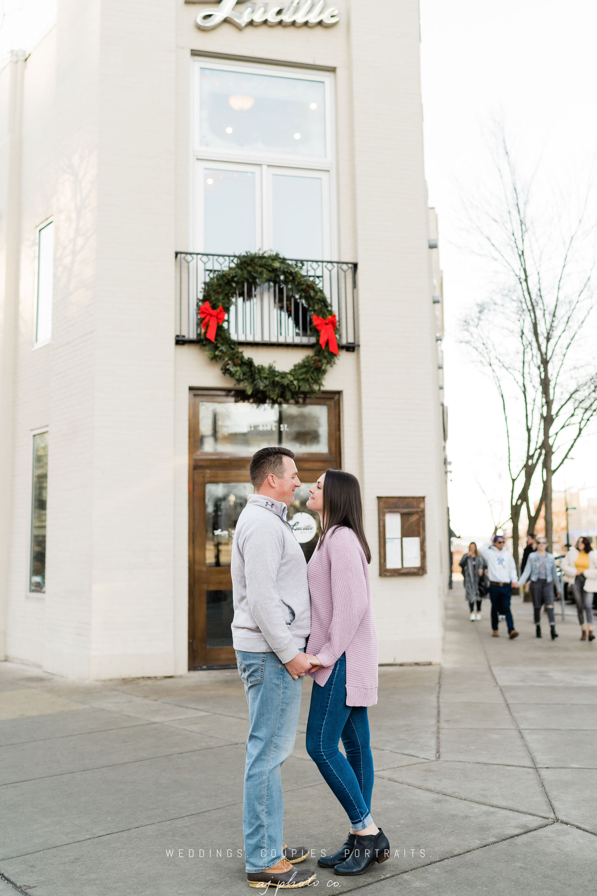 Engaged couple in front of Lucille in Madison, WI