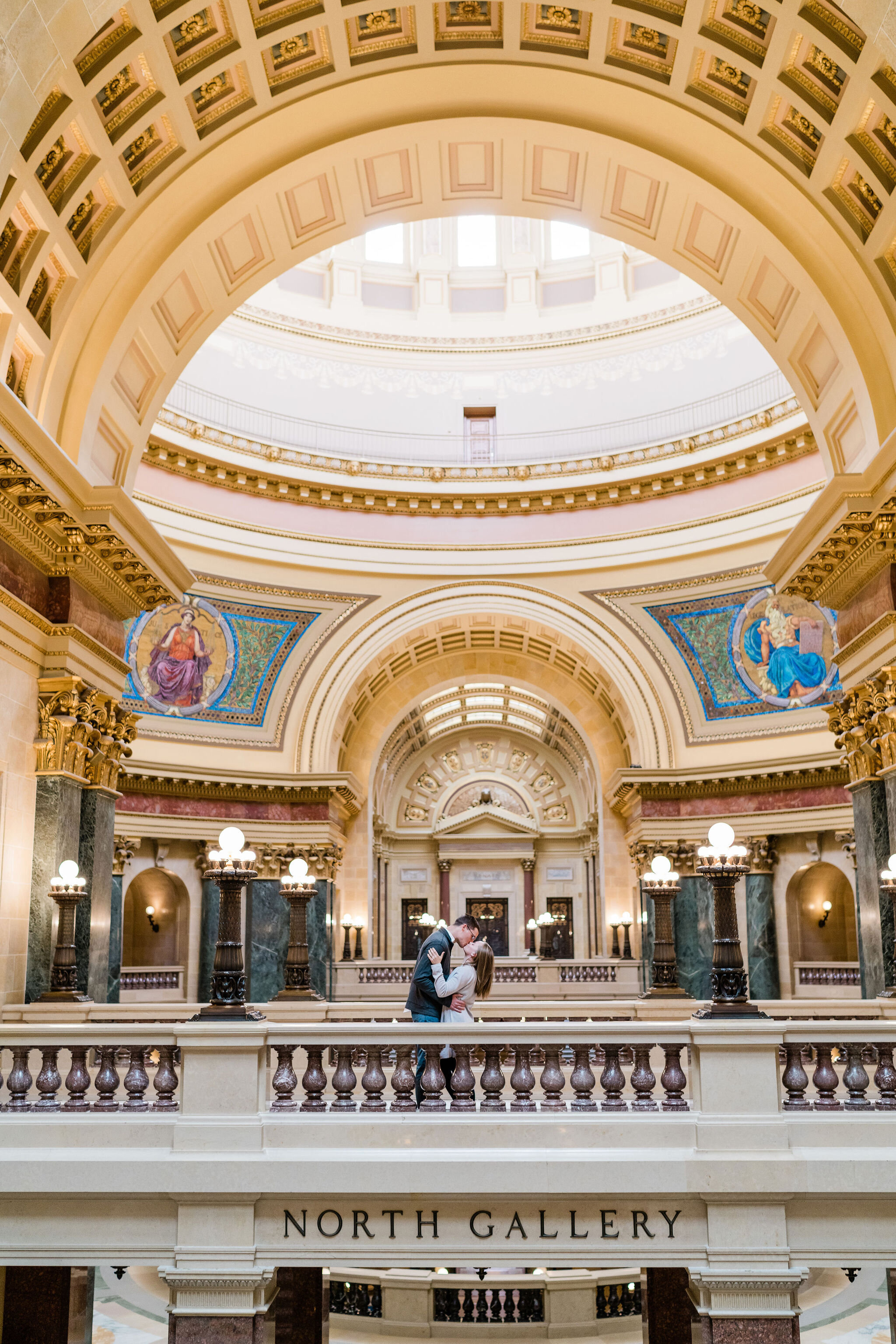 Engaged couple inside Wisconsin State Capitol in Madison, WI