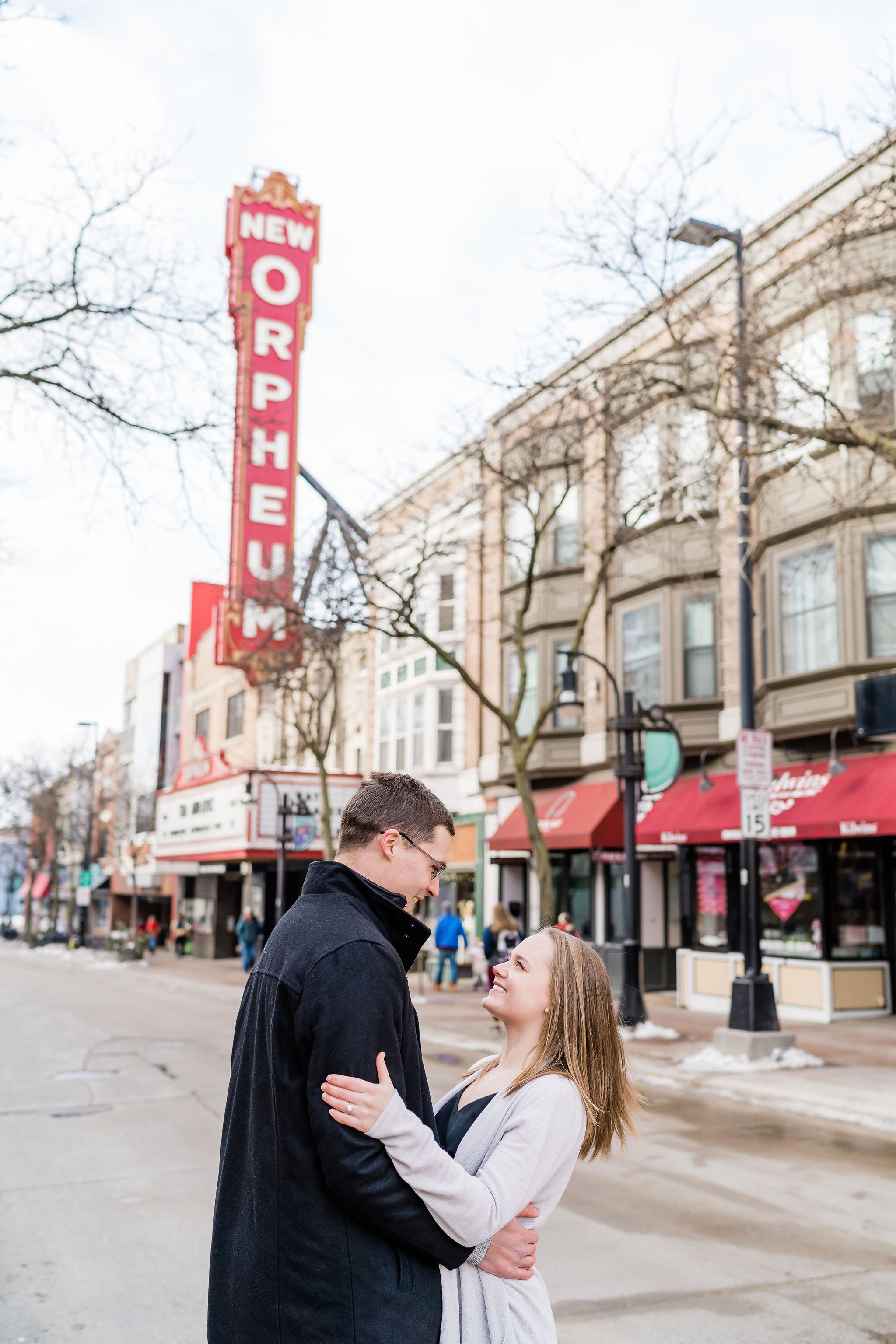 Engaged couple in front of The Orpheum in Madison, WI