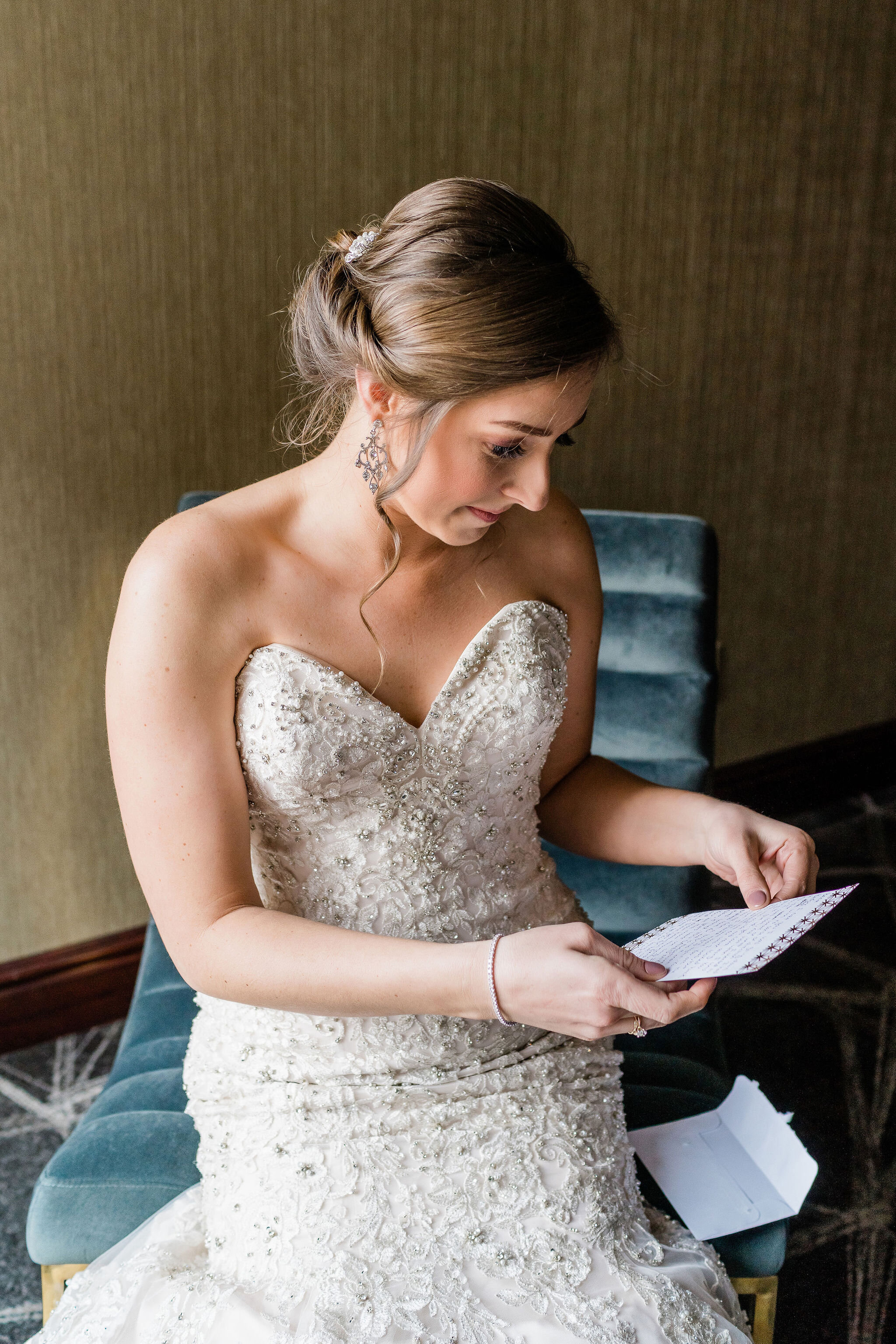 Bride reading a letter from the groom