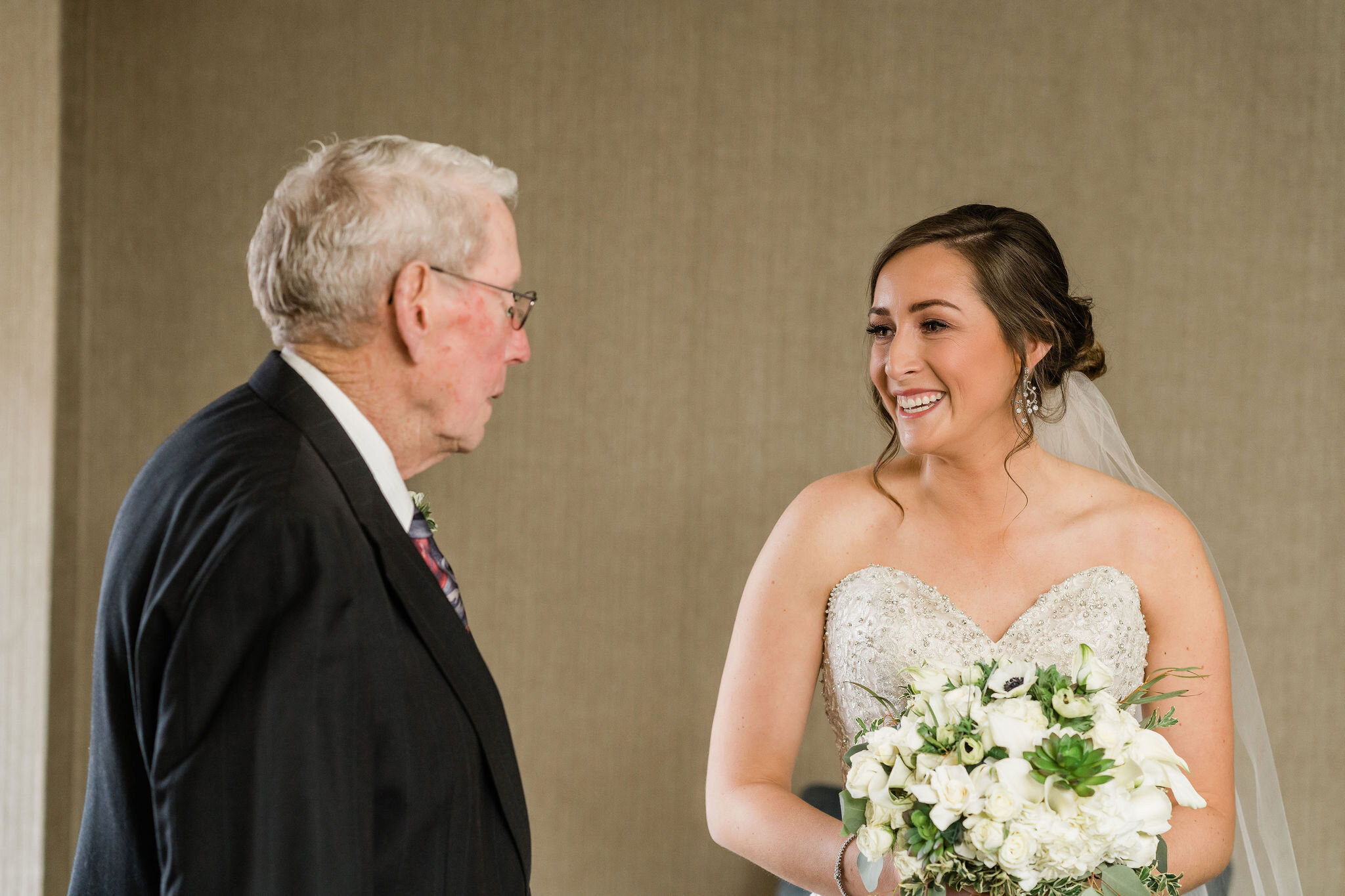 Bride smiling at her grandpa