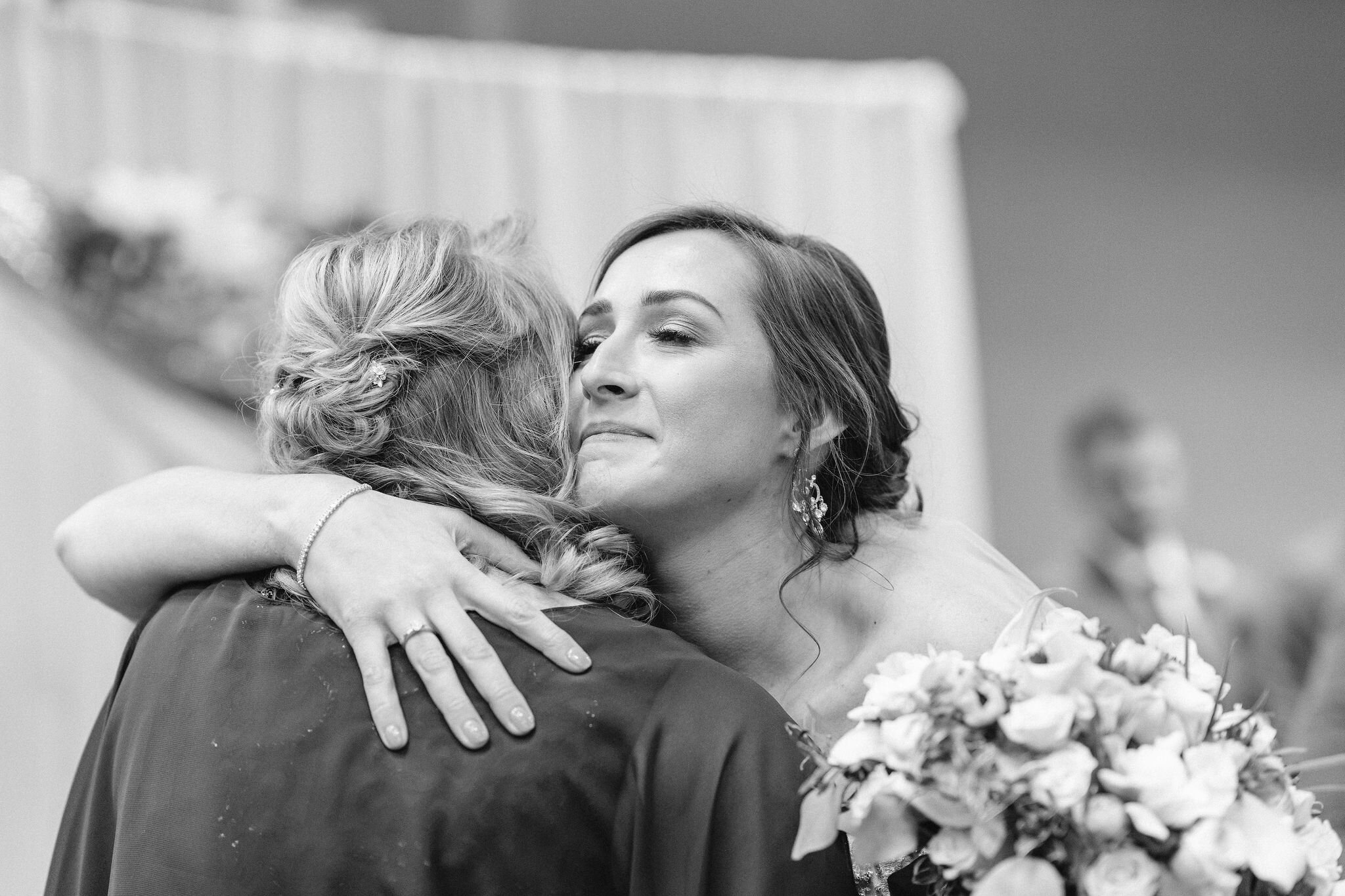 Bride hugging her mom