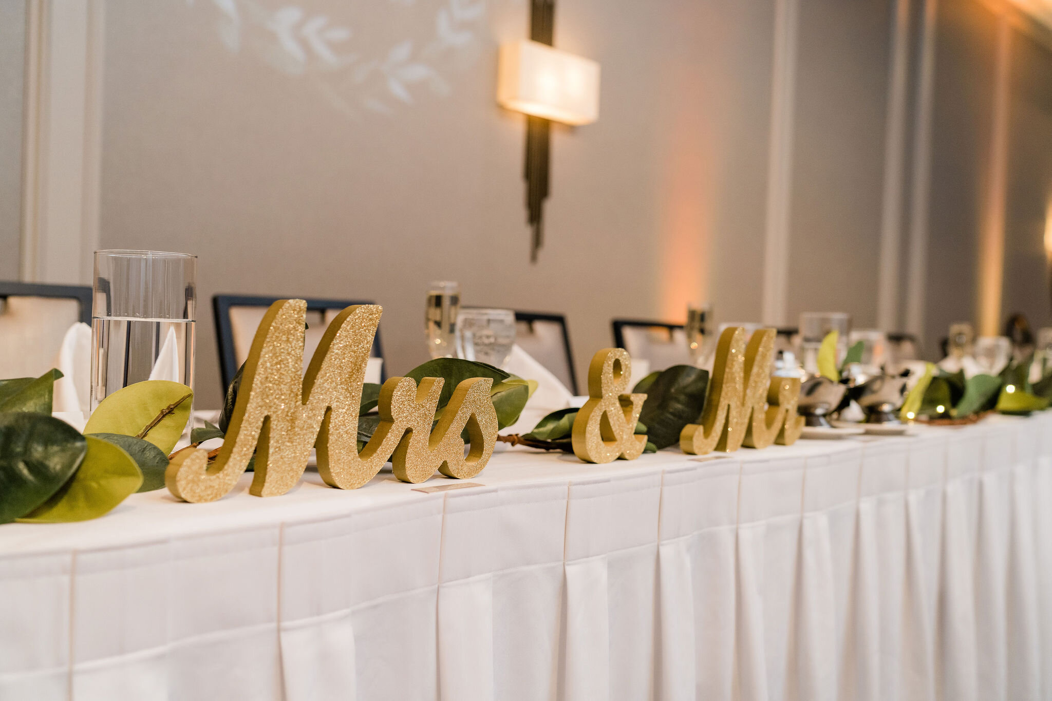 Mr. and Mrs. sign at head table