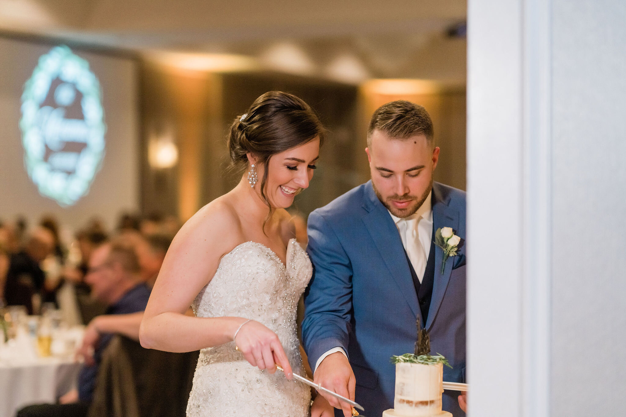 Bride and groom cutting their cake