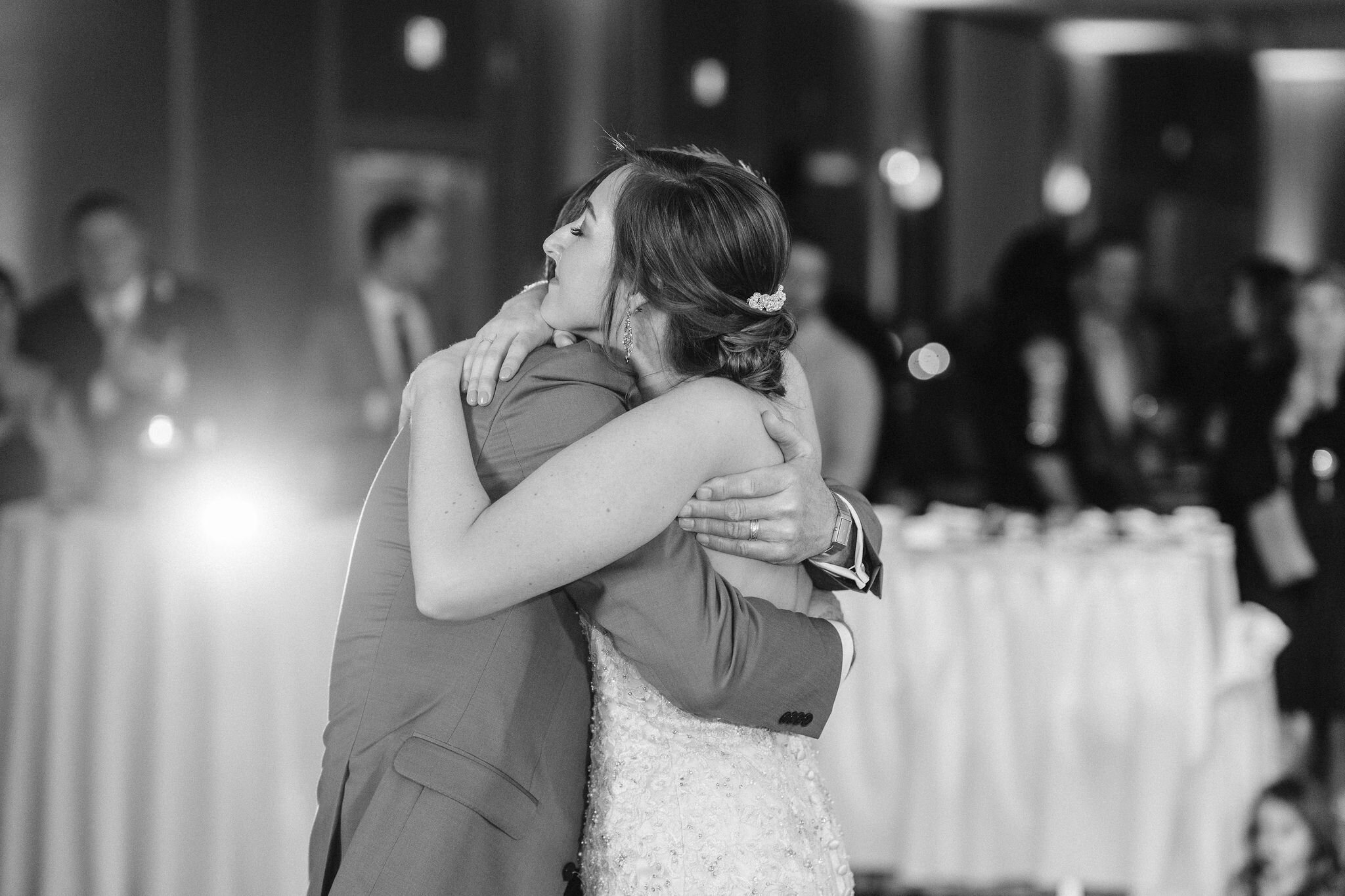 Bride hugging her father