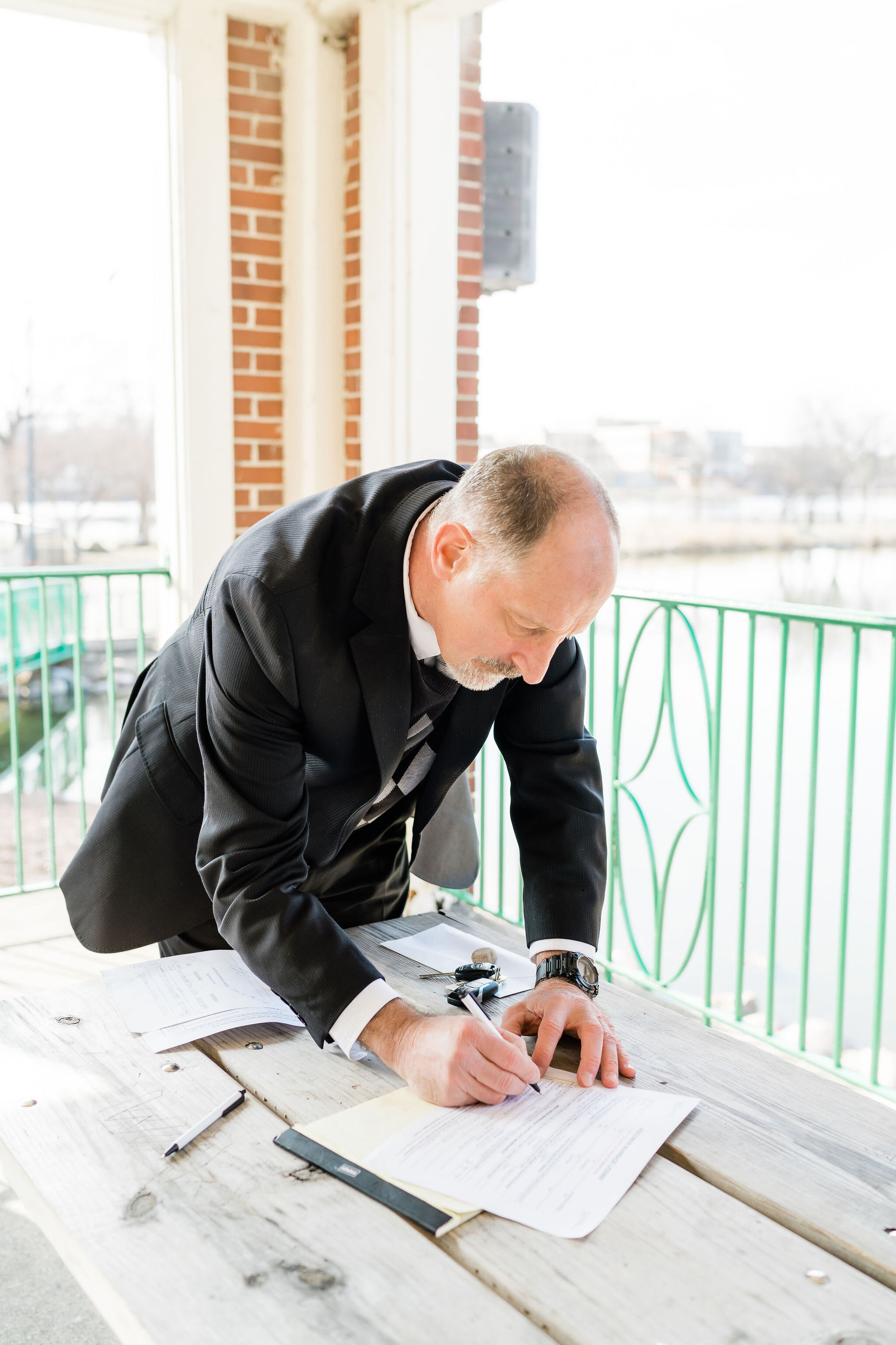 Officiant signing the marriage license