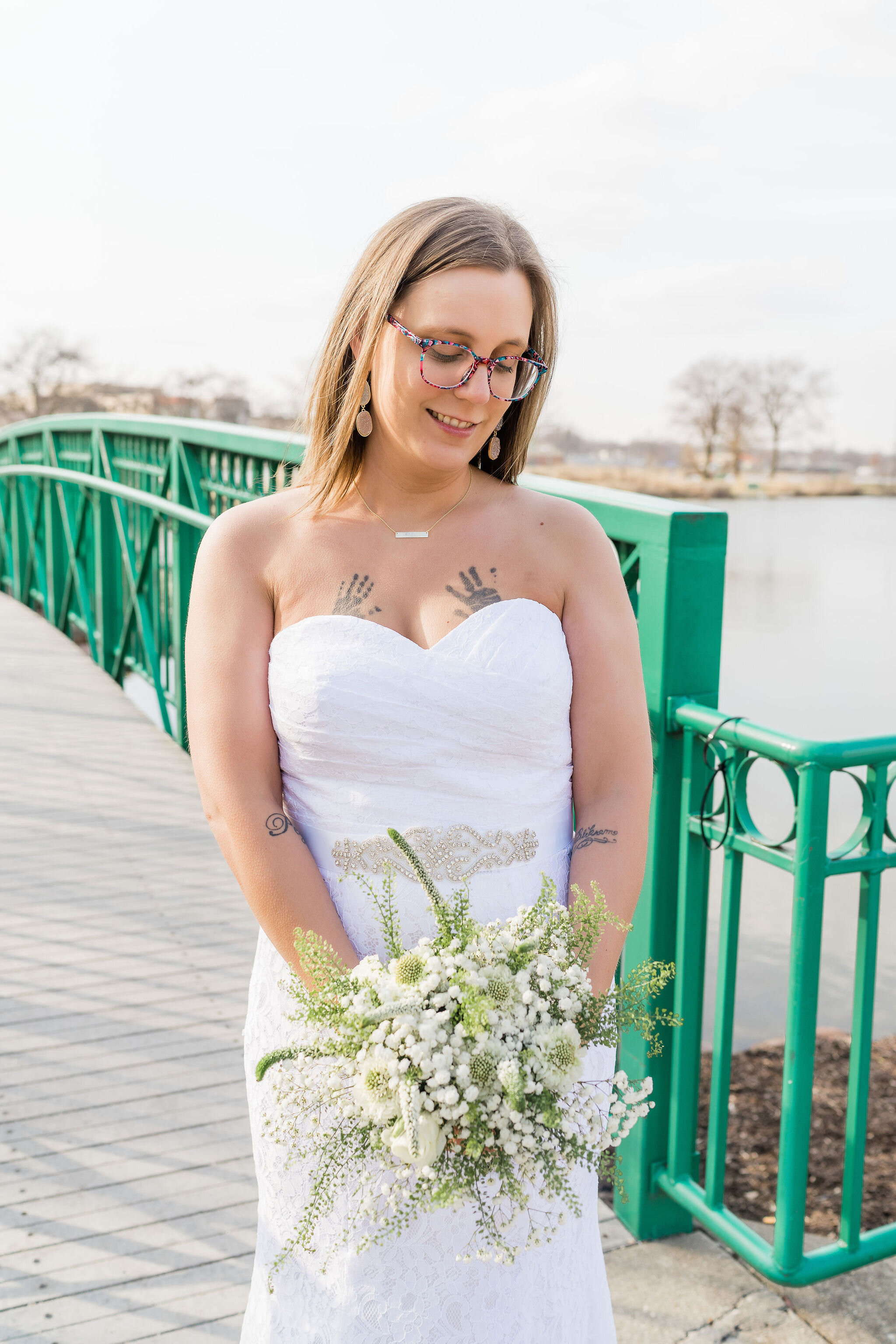 Bride looking down at her bouquet