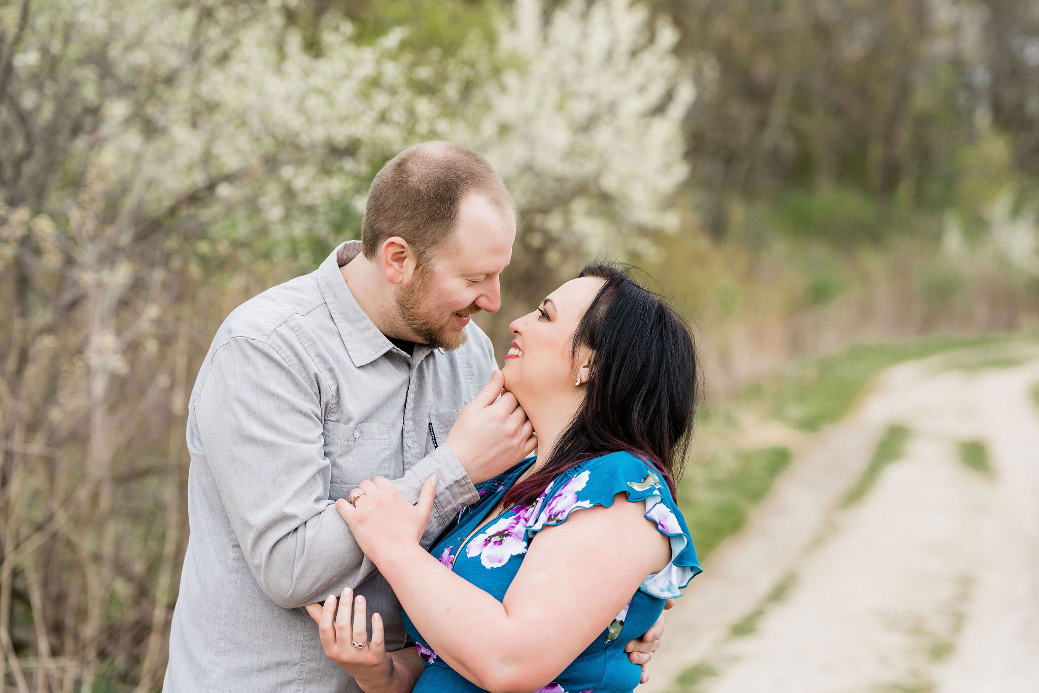 Engaged couple looking into each other's eyes