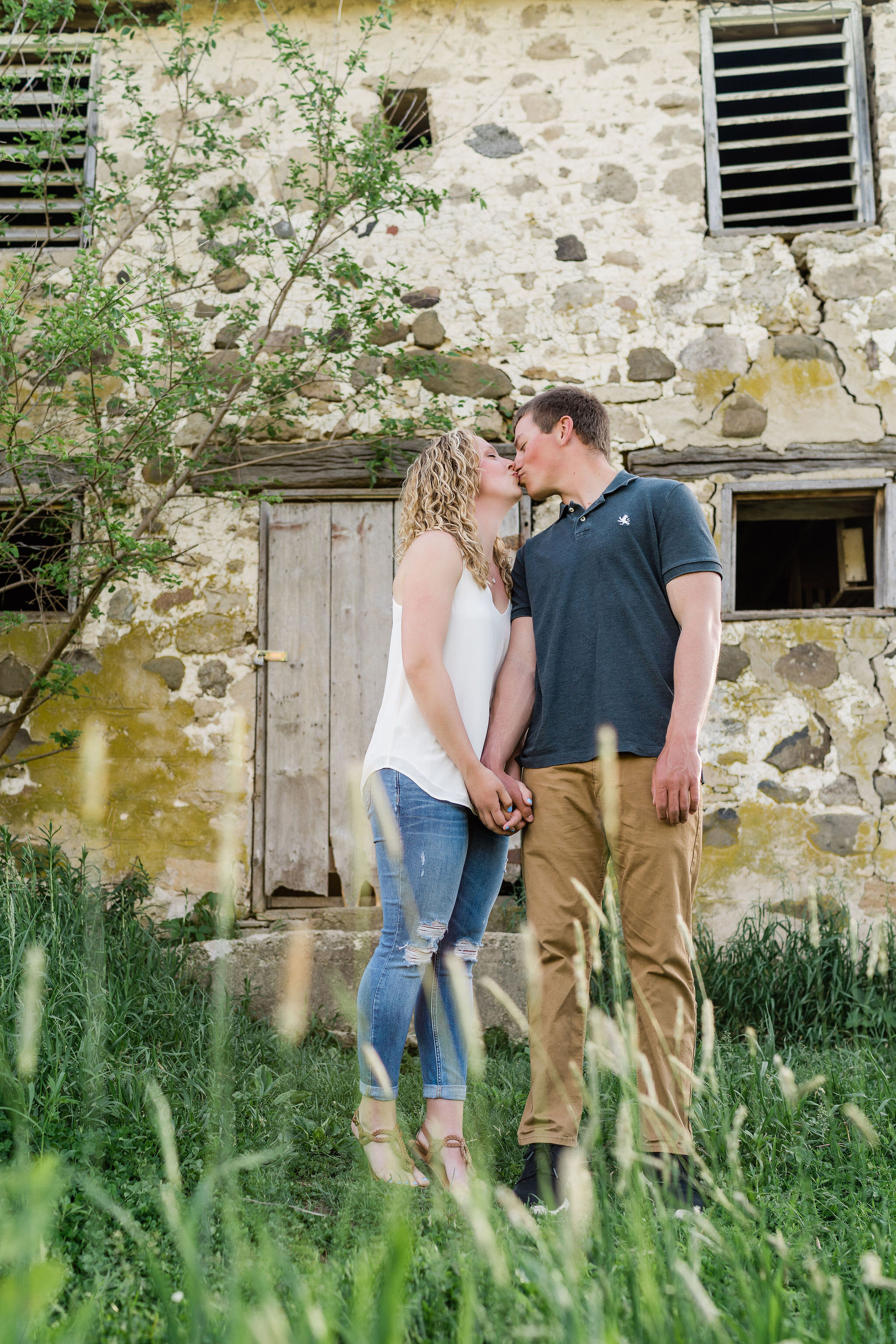 Engaged couple kissing