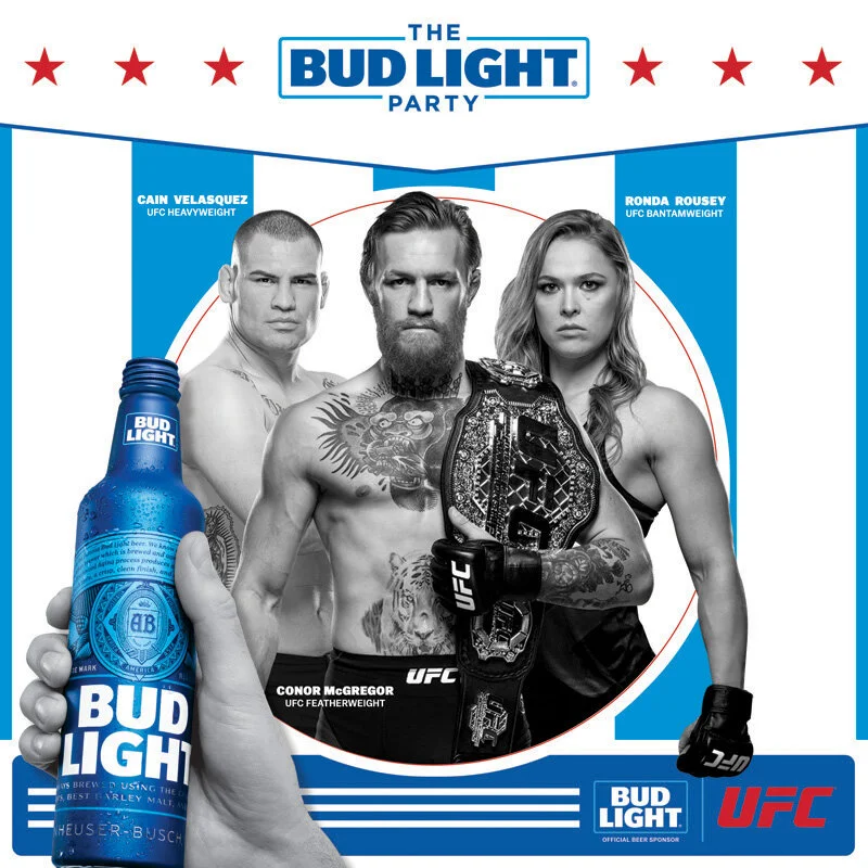 Poster for UFC event sponsored by Bud Light featuring fighters Cain Velasquez, Ronda Rousey, and Conor McGregor, with a large hand holding a Bud Light beer.