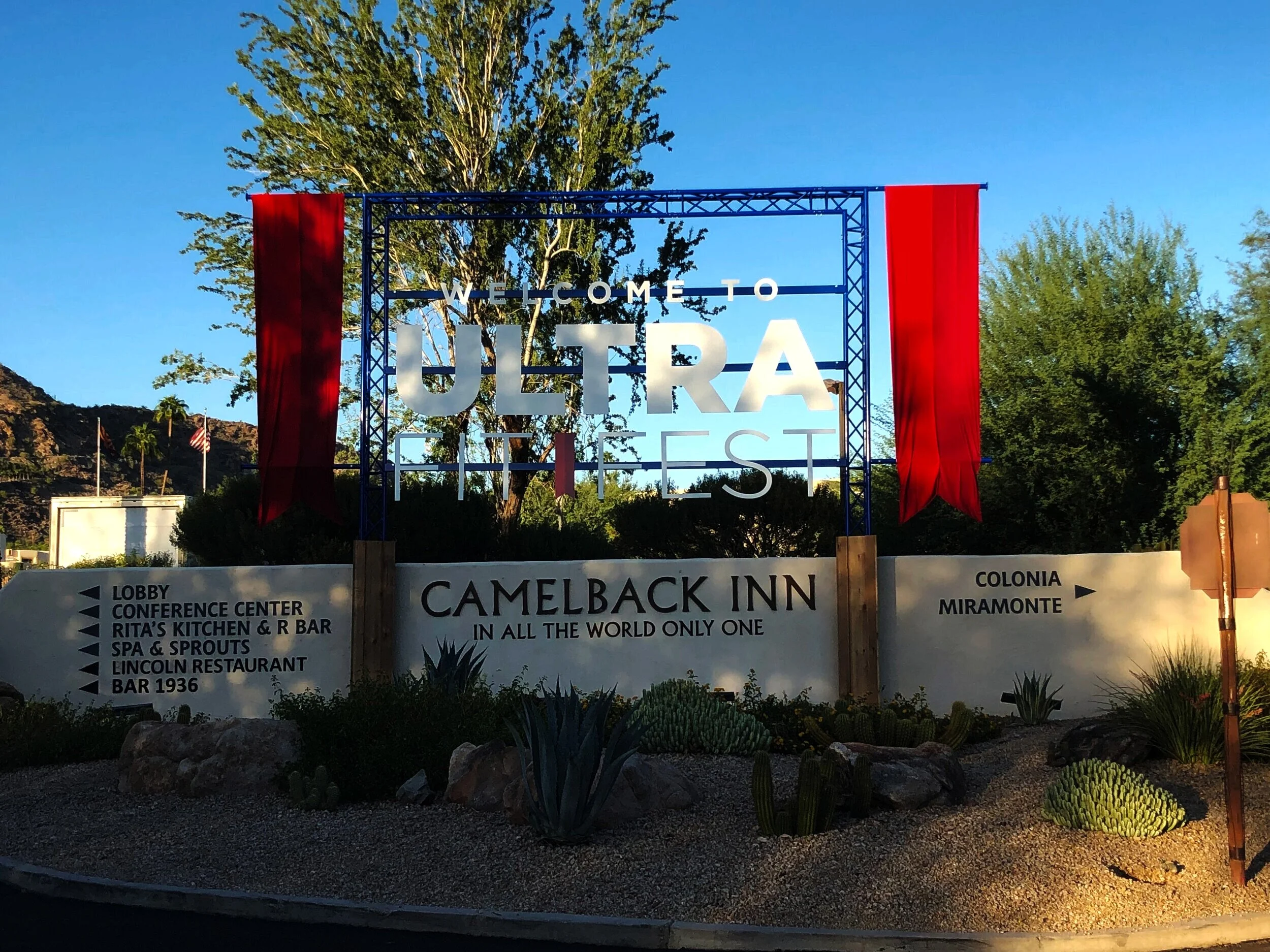 Welcome to Ultralist sign at Camelback Inn resort, with directions to various amenities and the desert landscape in the background.