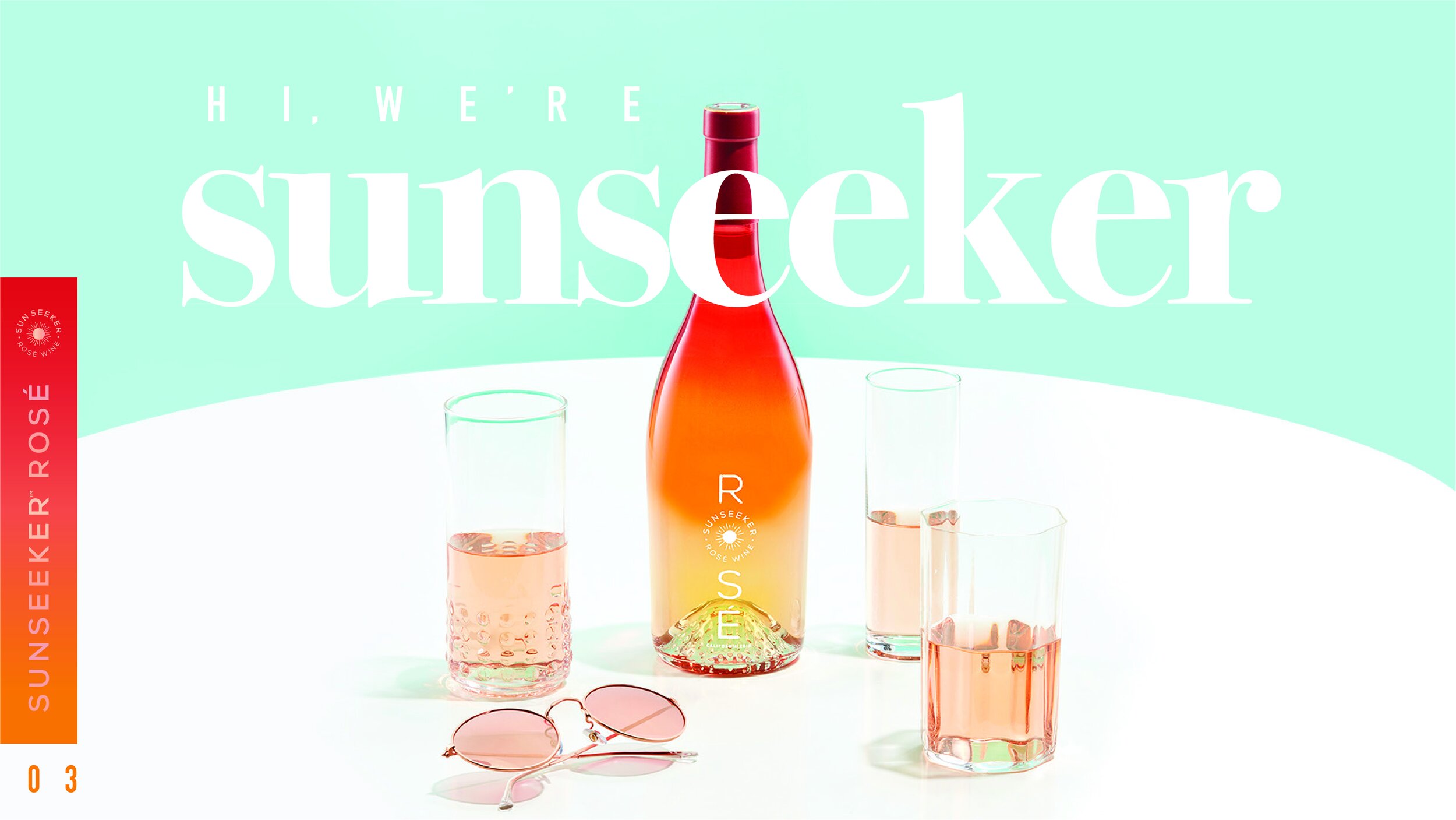 A bottle of rosé wine with the label 'S' is surrounded by four glasses of rosé wine and a pair of pink sunglasses on a white surface with a pastel background.