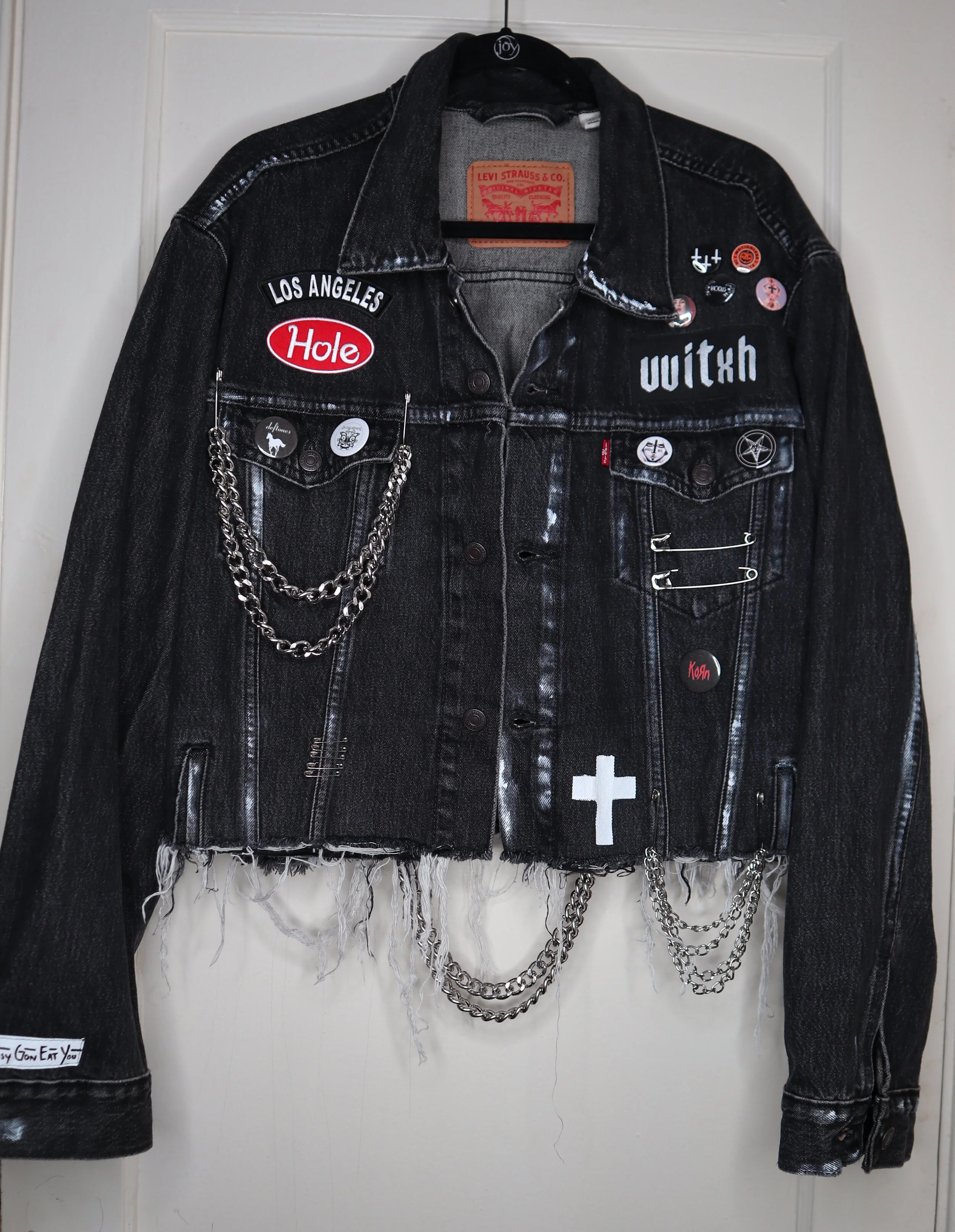 black denim jacket with writing