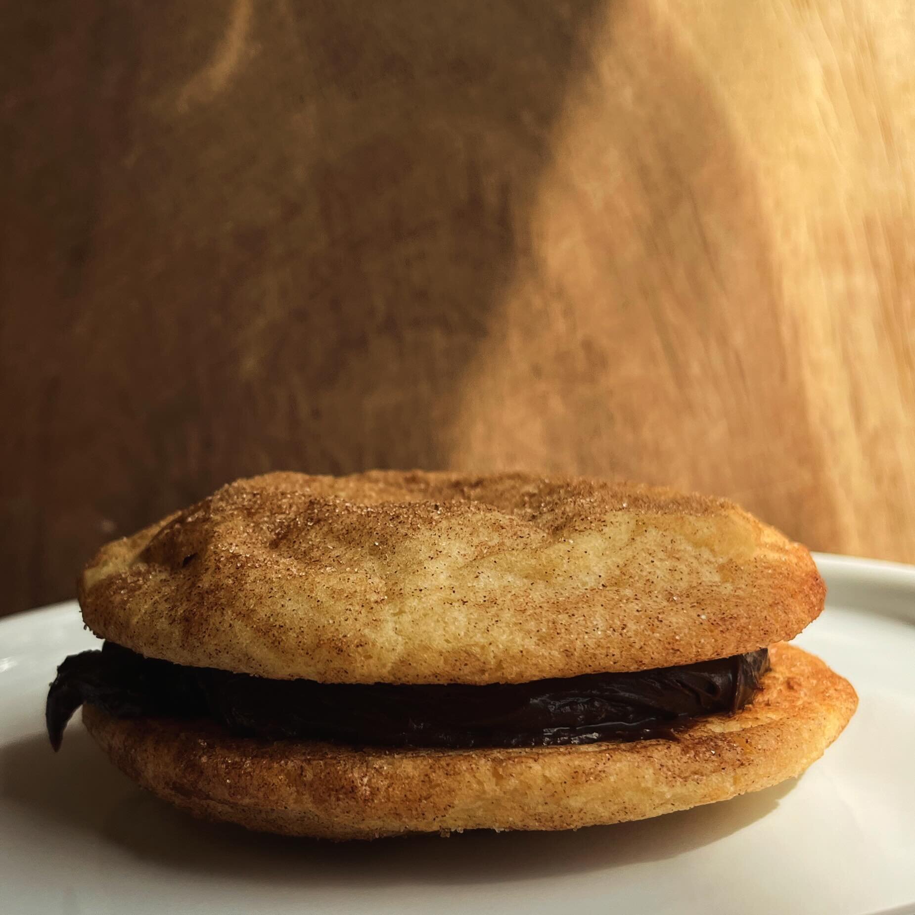 🥲🧑&zwj;💻👀 Good morning from a snickerdoodle and chocolate ganache sammie&hellip; 🥲 Thinking of fun things for both the next Online Cookie Store opening on March 18th &mdash; By the way, every order gets a free slice of pound cake! Sammies might 