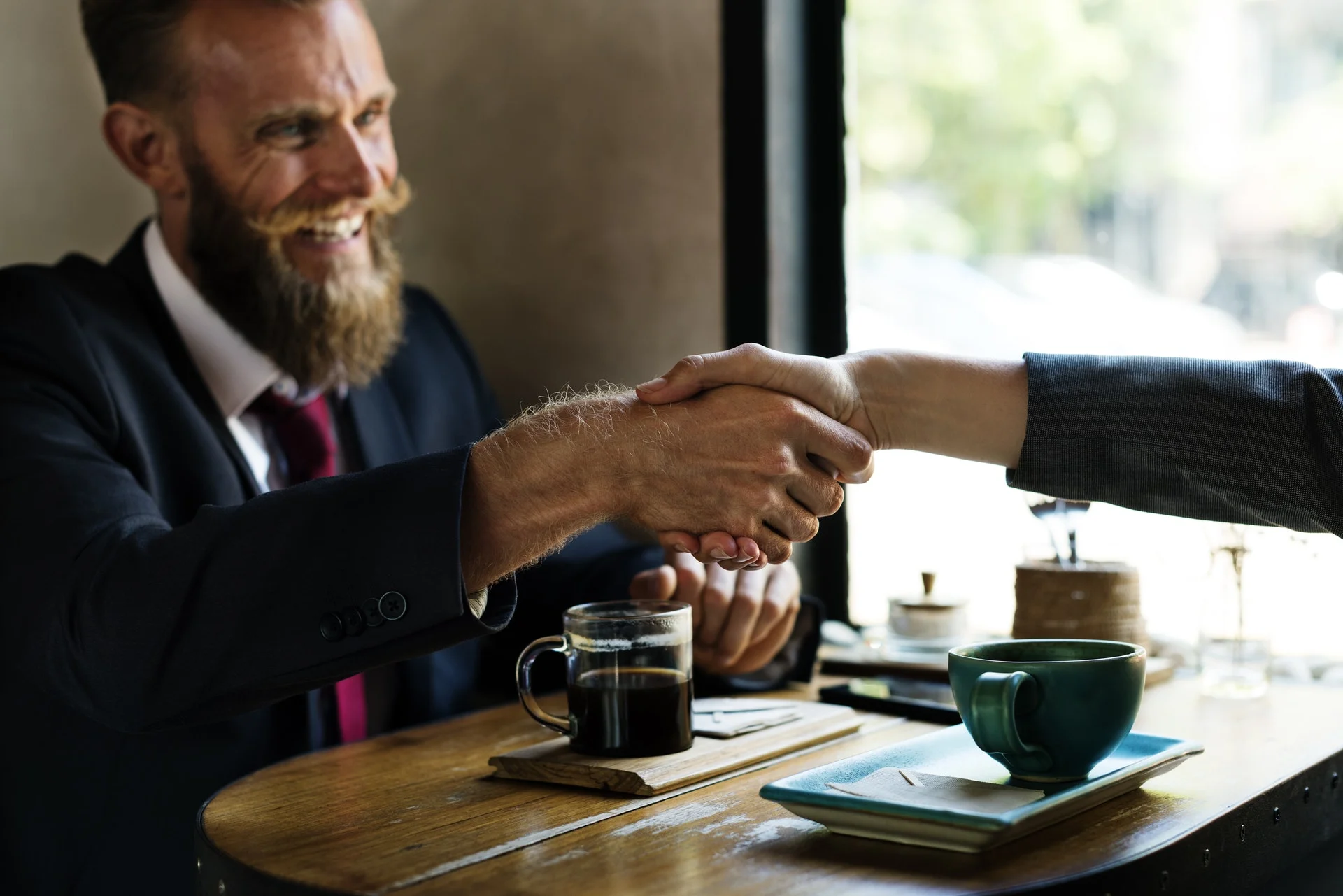 This man has a spectacular mustache and also appears to be negotiating spectacularly.