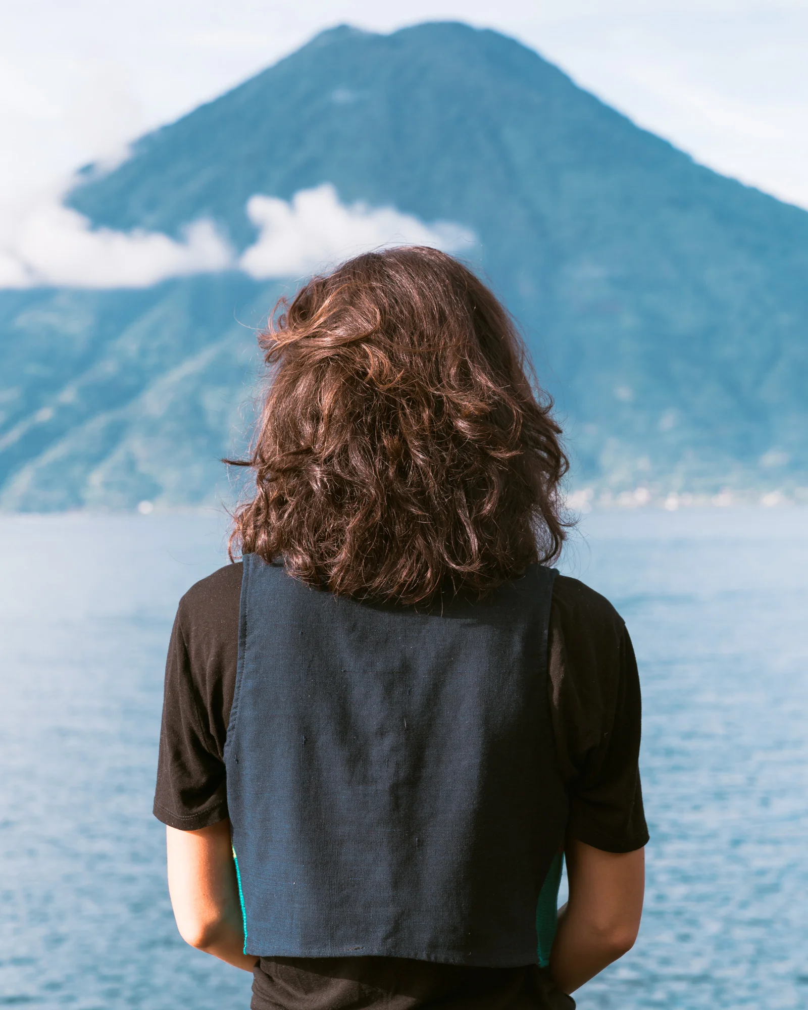 Woman looking at Volcano Toliman at Lake Atitlan
