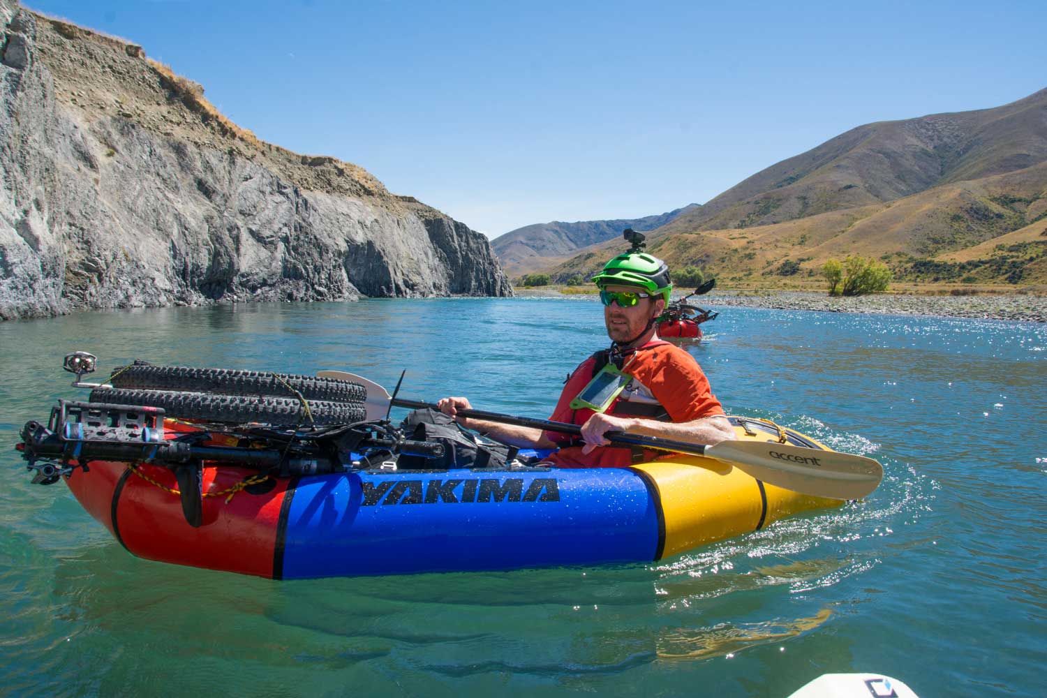 Self-bailing packraft