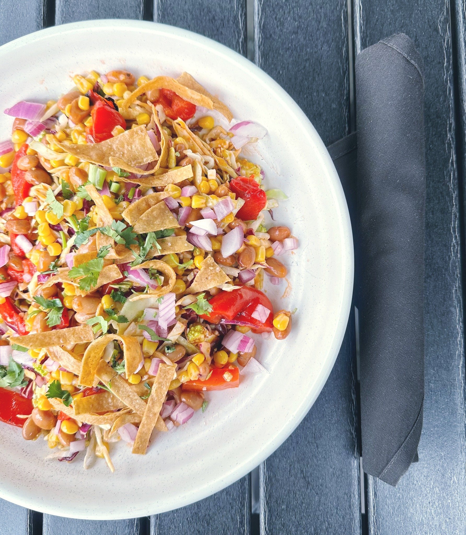 Have you tried our new Santa Fe Cruciferous Salad? We mix shredded cabbage, kale, and cauliflower in our chipotle catalina dressing then top it with sweet corn, pinto beans, red onion, roasted red peppers, cilantro, chopped almonds, and tortilla stri