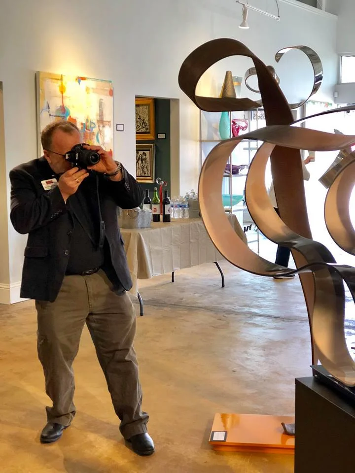 I enjoy shooting photos of everything. Here I am photographing some wonderful art pieces (not mine) at the Frisco Fine Art gallery.