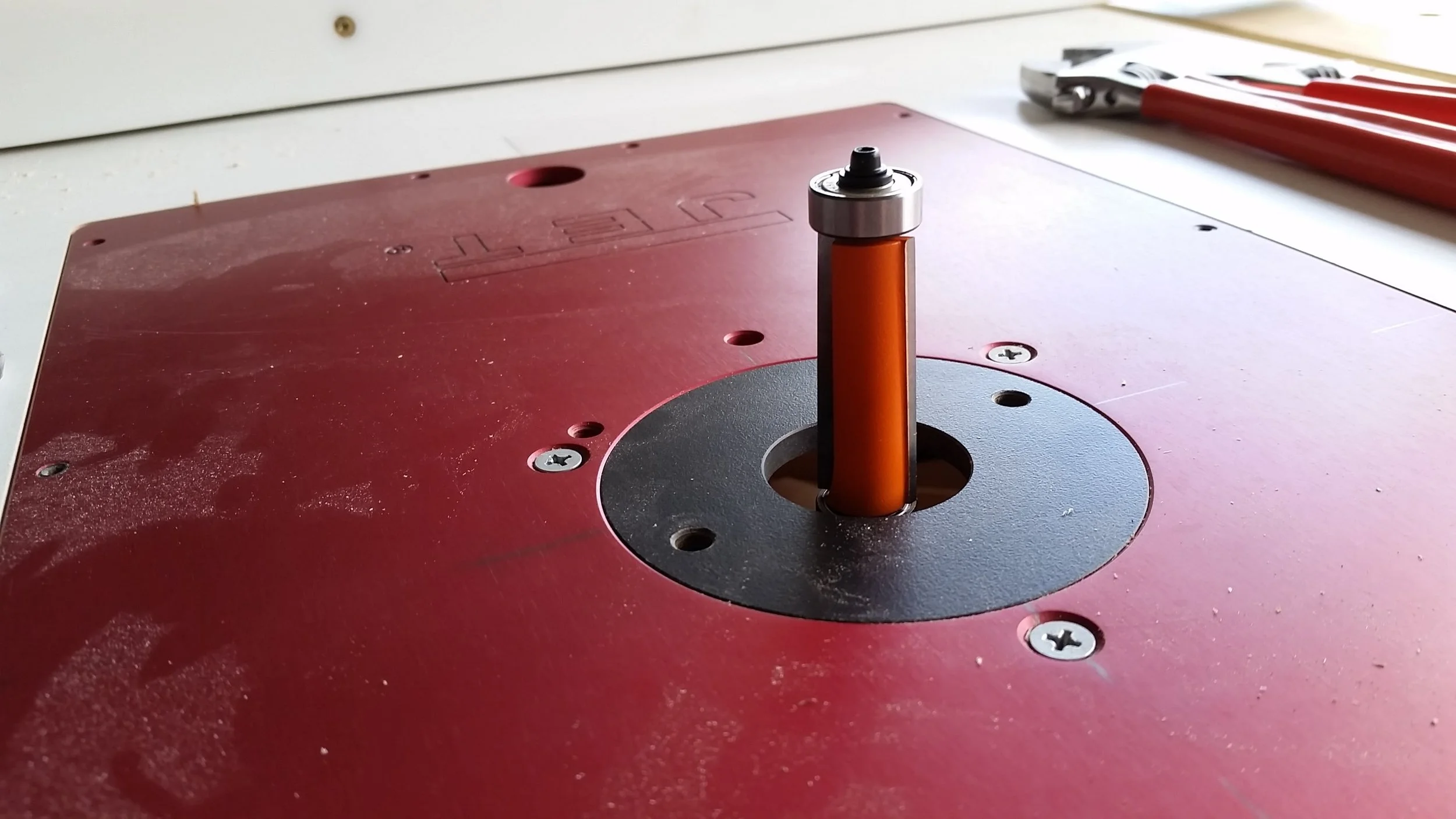 New 2" flush trim router bit with top and bottom bearings mounted in the router table.