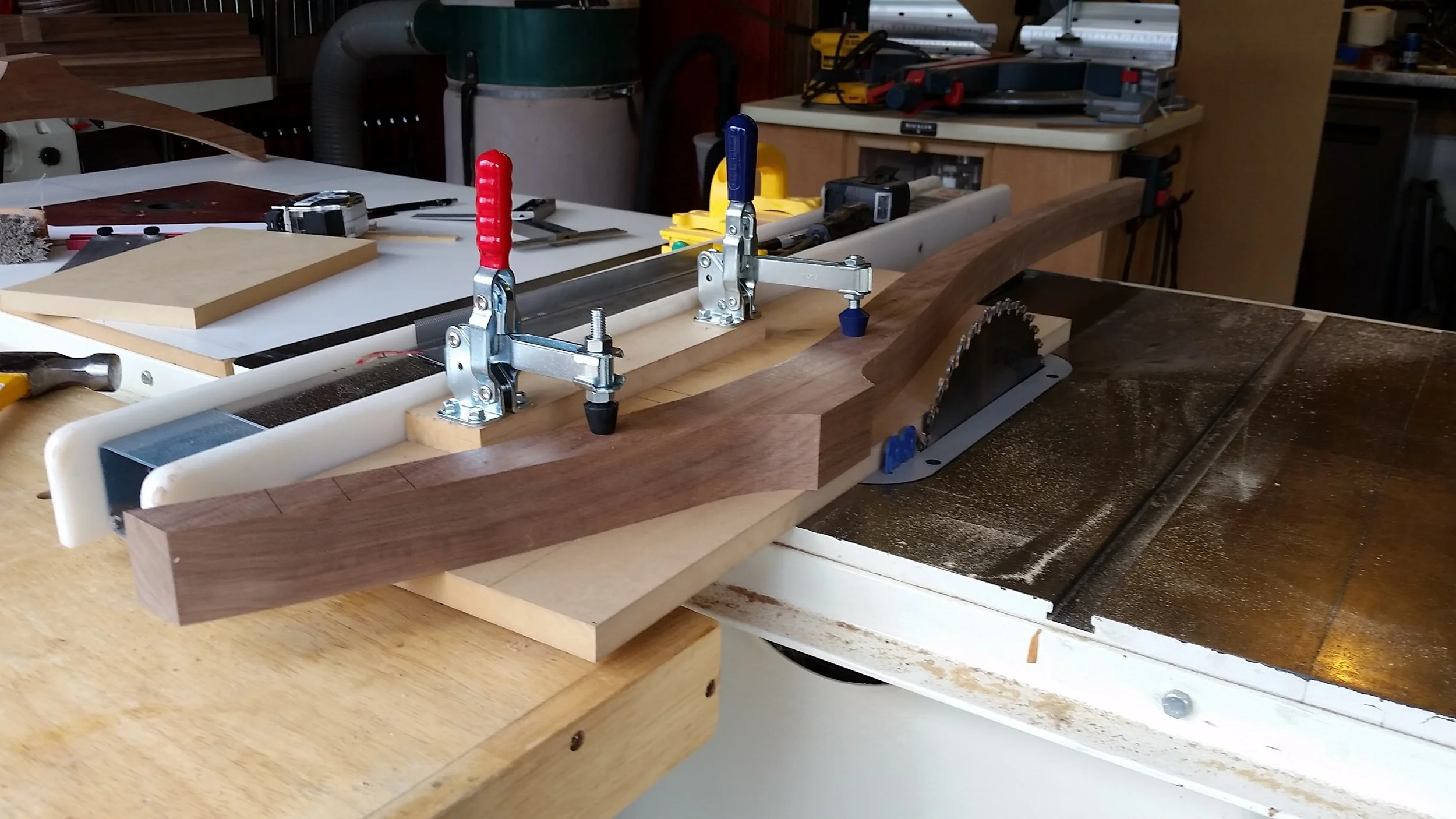 Rear leg clamped in jig and run through the table saw to cut the angle where the seat will join to the rear leg.