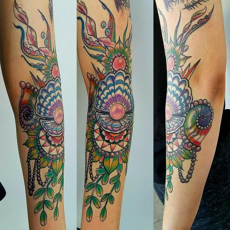 Sea shell tattoo