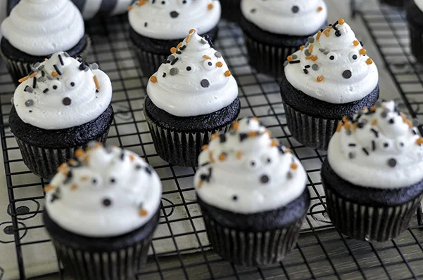 Chocolate Ghost Cupcakes_decorated on wire rack.jpg