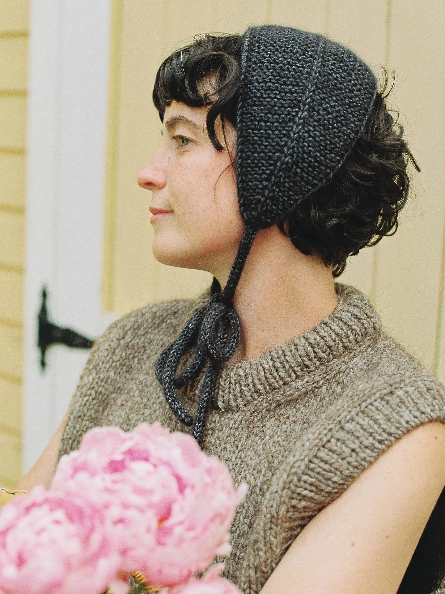 The Folklore bonnet. Made from the softest merino wool and mohair, it&rsquo;s a charming accessory to jazz up your outfit. It can be tied under the chin to cover your ears, or at the nape of the neck, to tie back your hair as you work chores. The per