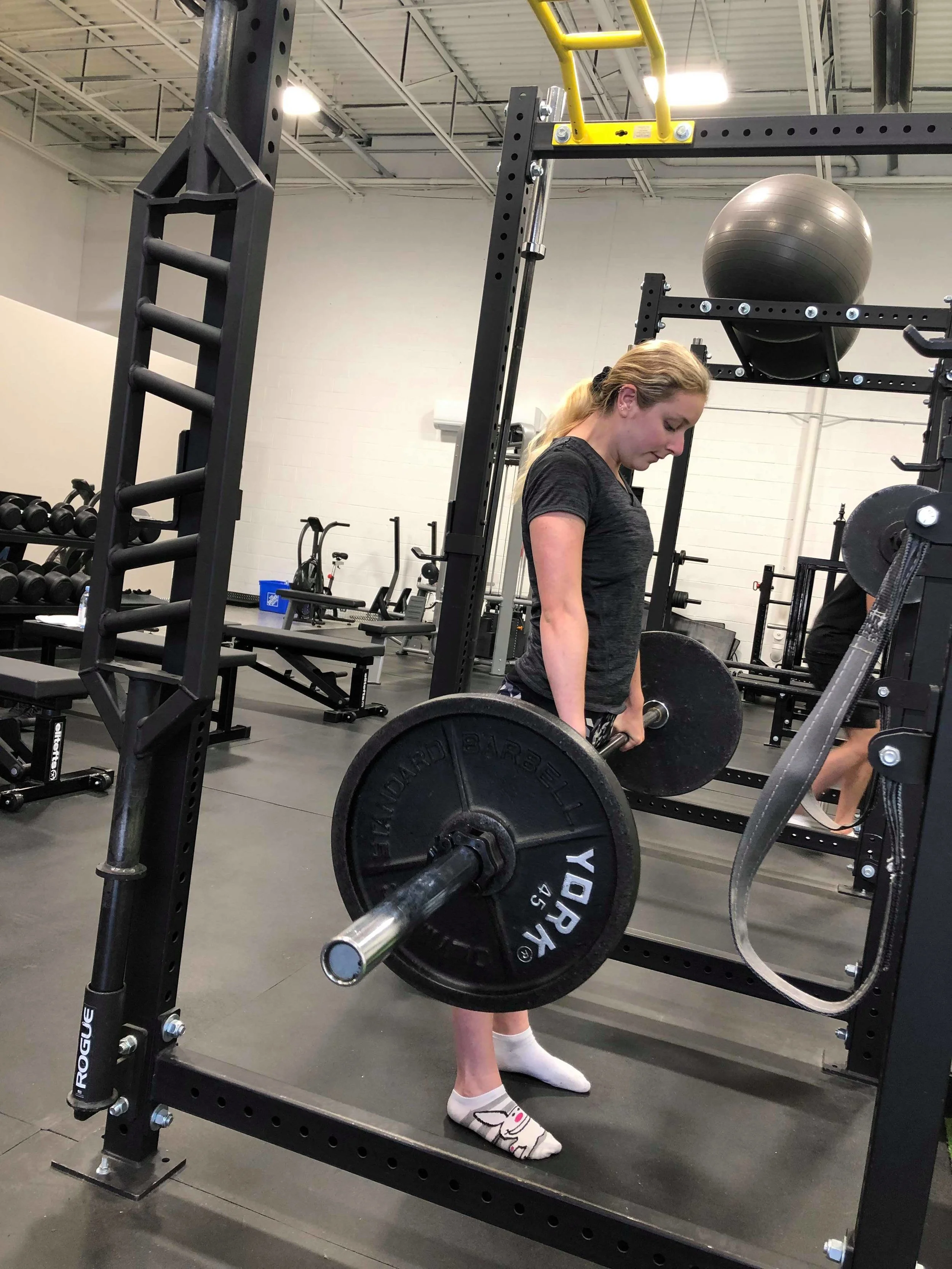 Michaela lifting 135 lbs for a deadlift personal best.