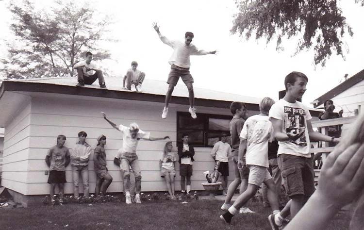 Shane De Leon jumping at a Billings punk party
