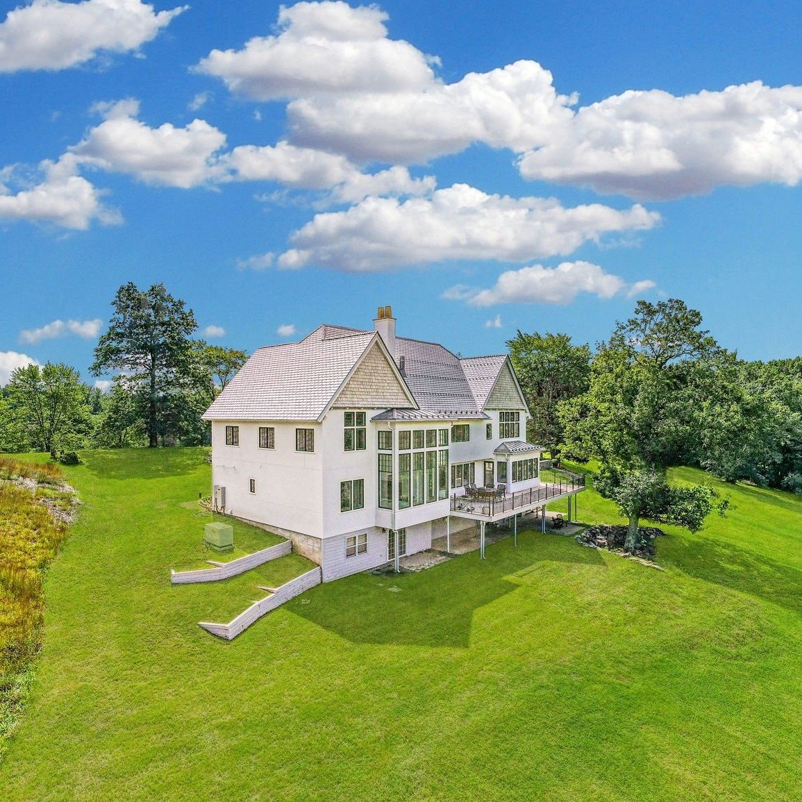🏡⛰️ Check out this incredible drone shot of our Early English Arts &amp; Crafts Revival project near New Paltz! Perfectly positioned, the home&rsquo;s windows frame breathtaking views of the Shawangunk cliffs. Designing homes that harmonize with the