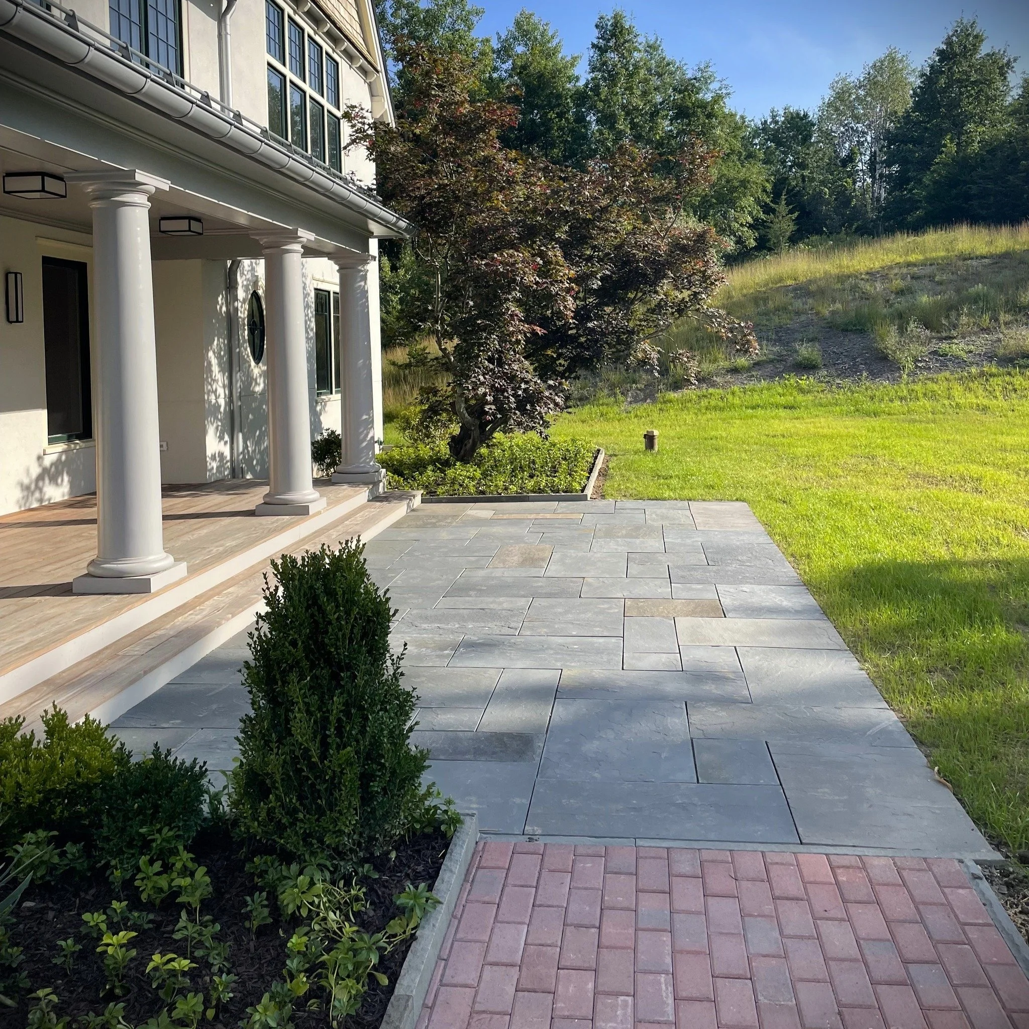 Bluestone Hardscapes. Formed 400&ndash;350 million years ago during the Devonian Period, bluestone originated from sand, silt, and clay that accumulated in a vast shallow sea, eventually transforming into the durable stone we see today. 

Here in the