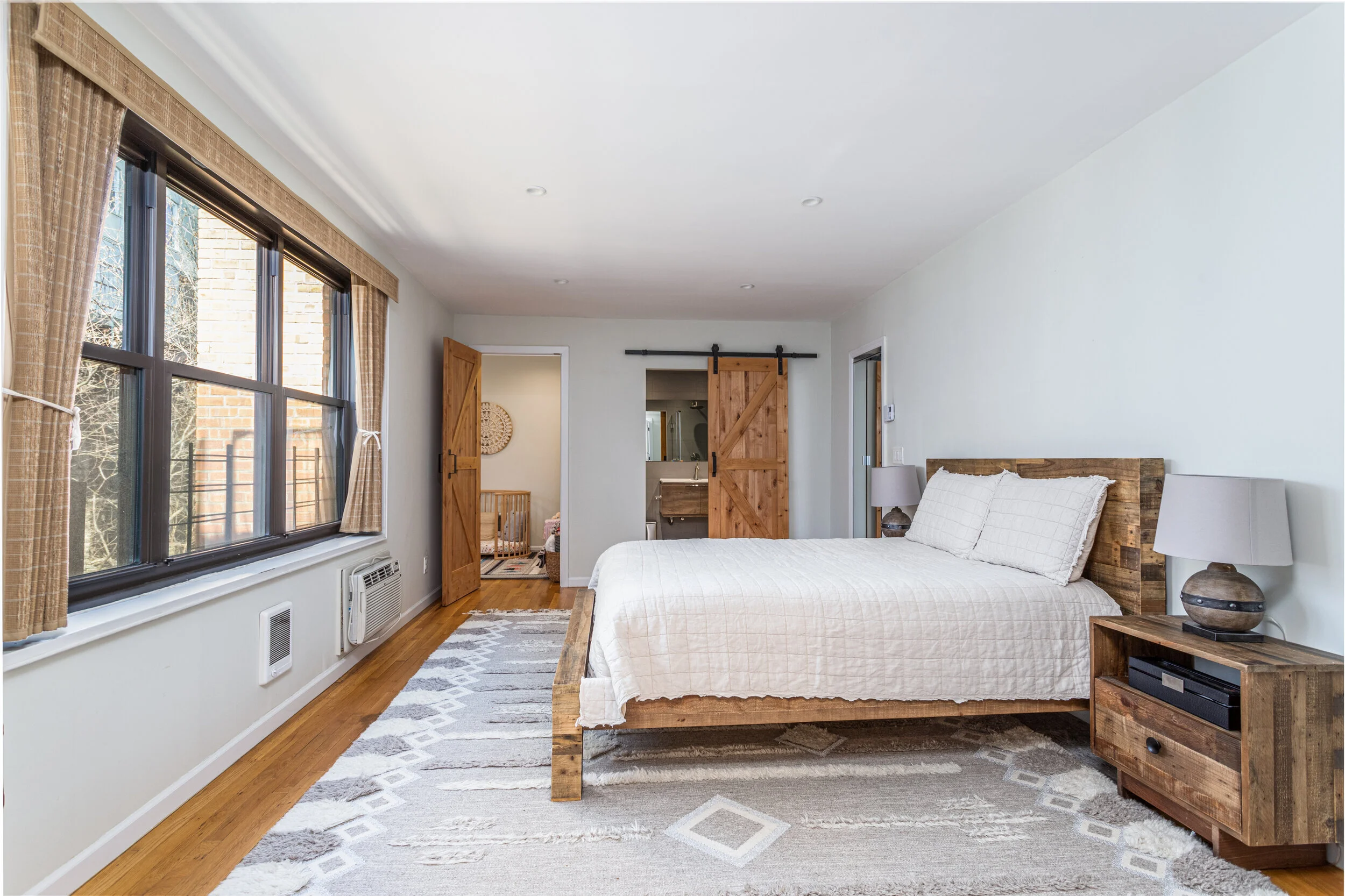 House master bedroom with rustic interior and en-suite bathroom