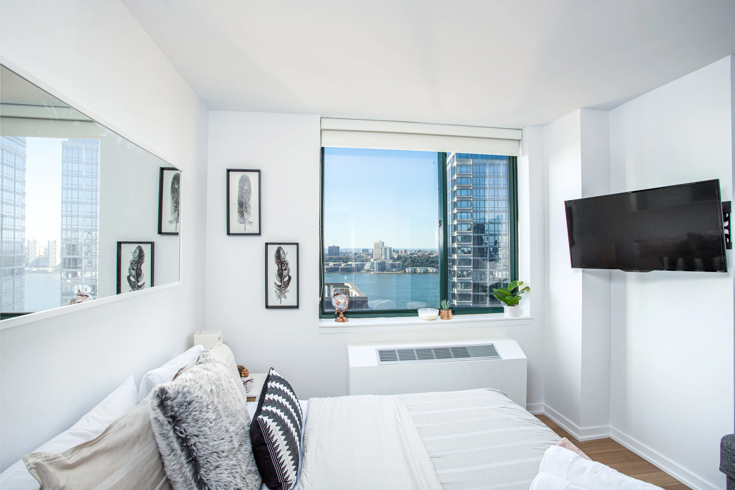 Modern Minimalist NYC Apartment Bedroom with City View