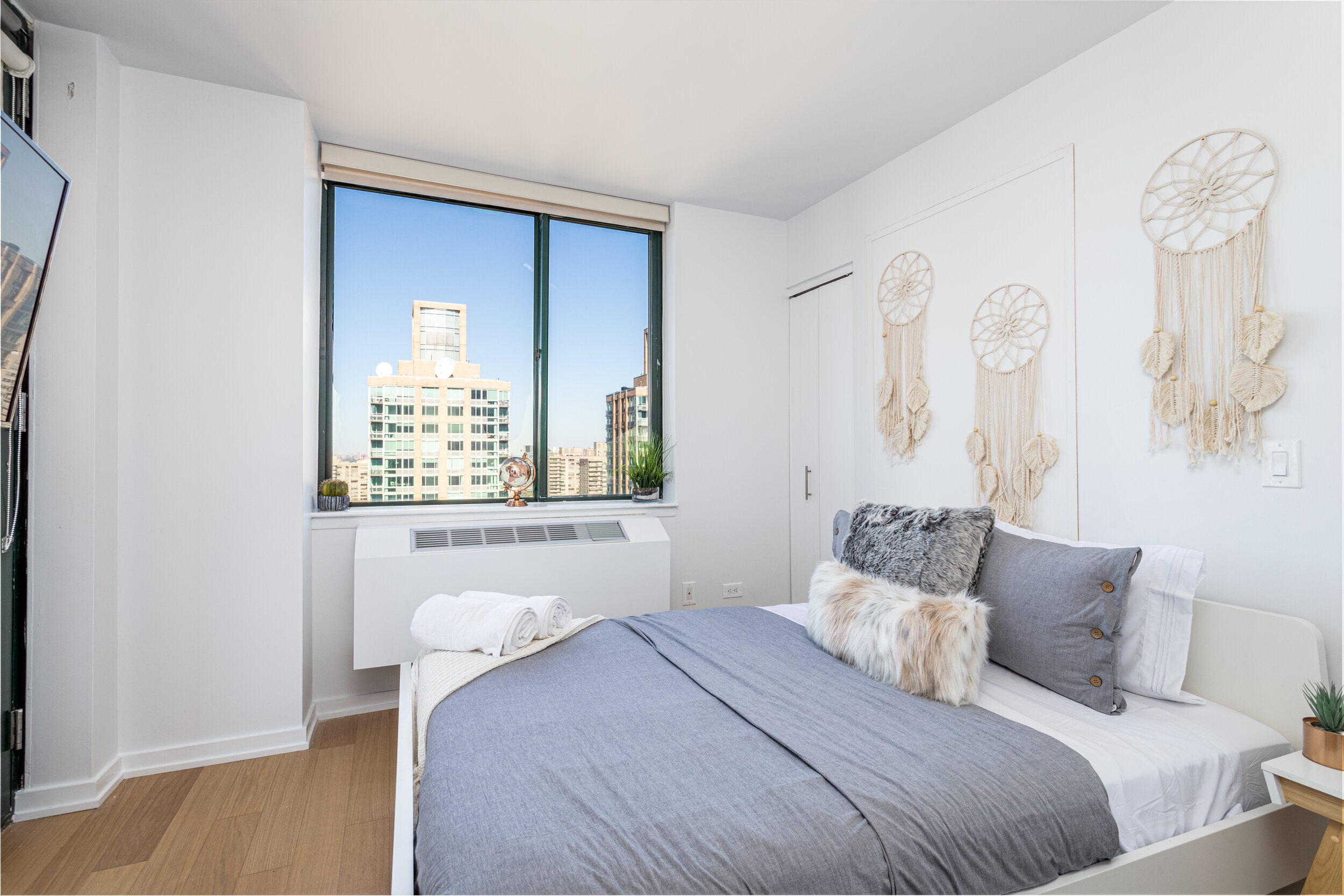 Modern Minimalist NYC Apartment Bedroom with City View