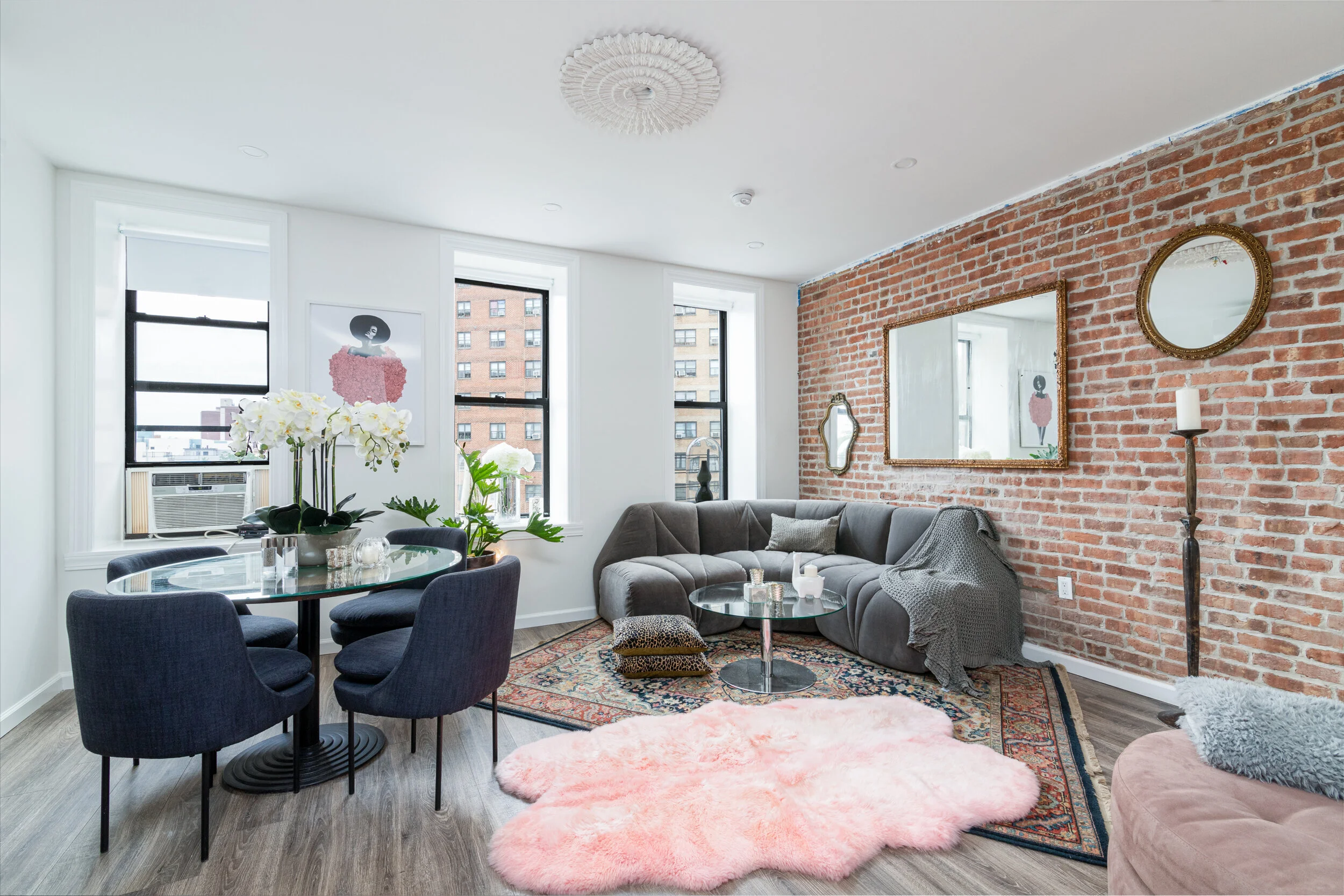 Modern NYC Apartment Living Dining Area with Exposed Brick Wall