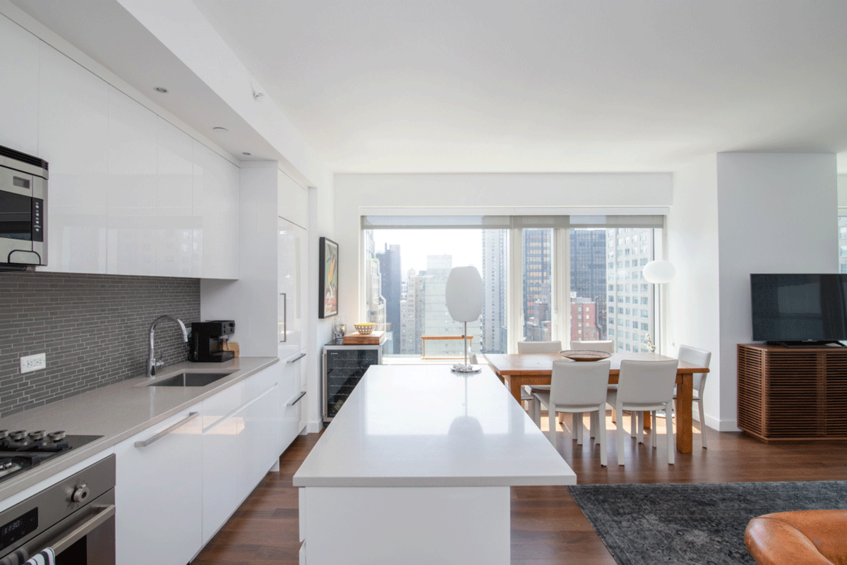 Minimal modern lounge kitchen area with a view of New York City