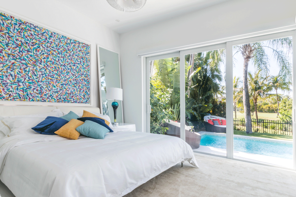 Minimal Master bedroom with sliding doors to a swimming pool