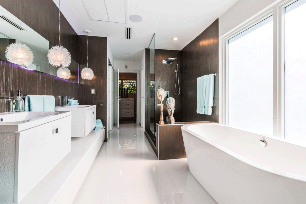 Large bathroom with dark wood and minimal white tile finish