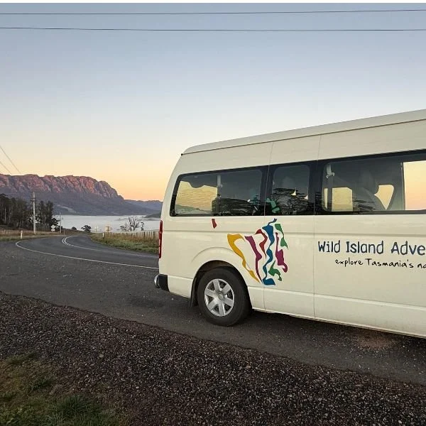 Wild Island Adventure Bus with mount roland in background
