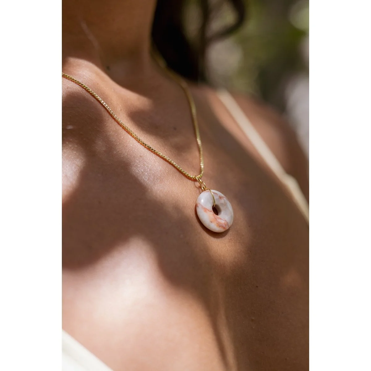 pink stone disc pendant necklace in gold